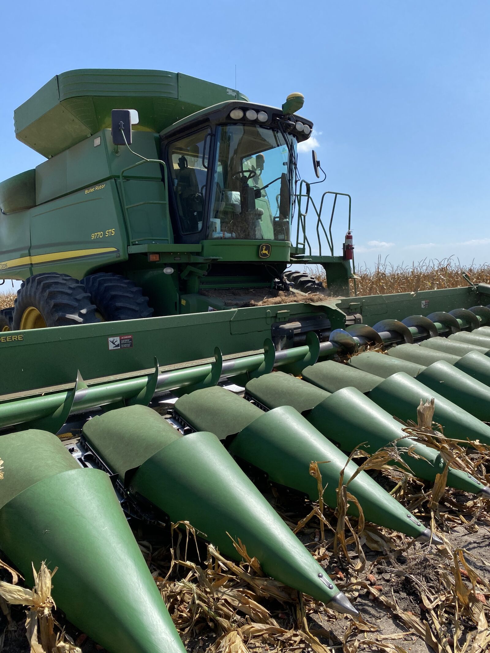 Apple iPhone 11 Pro Max sample photo. Green combine, harvest, corn photography