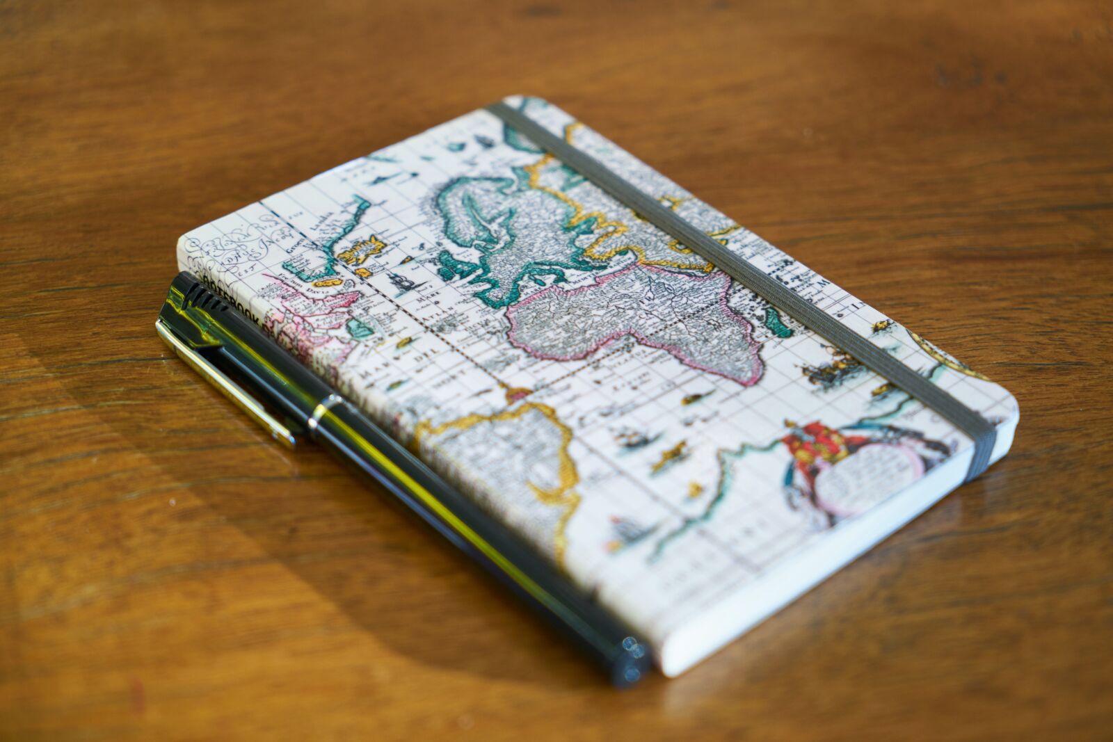 Sony a7R II sample photo. Notebook, book, pen photography
