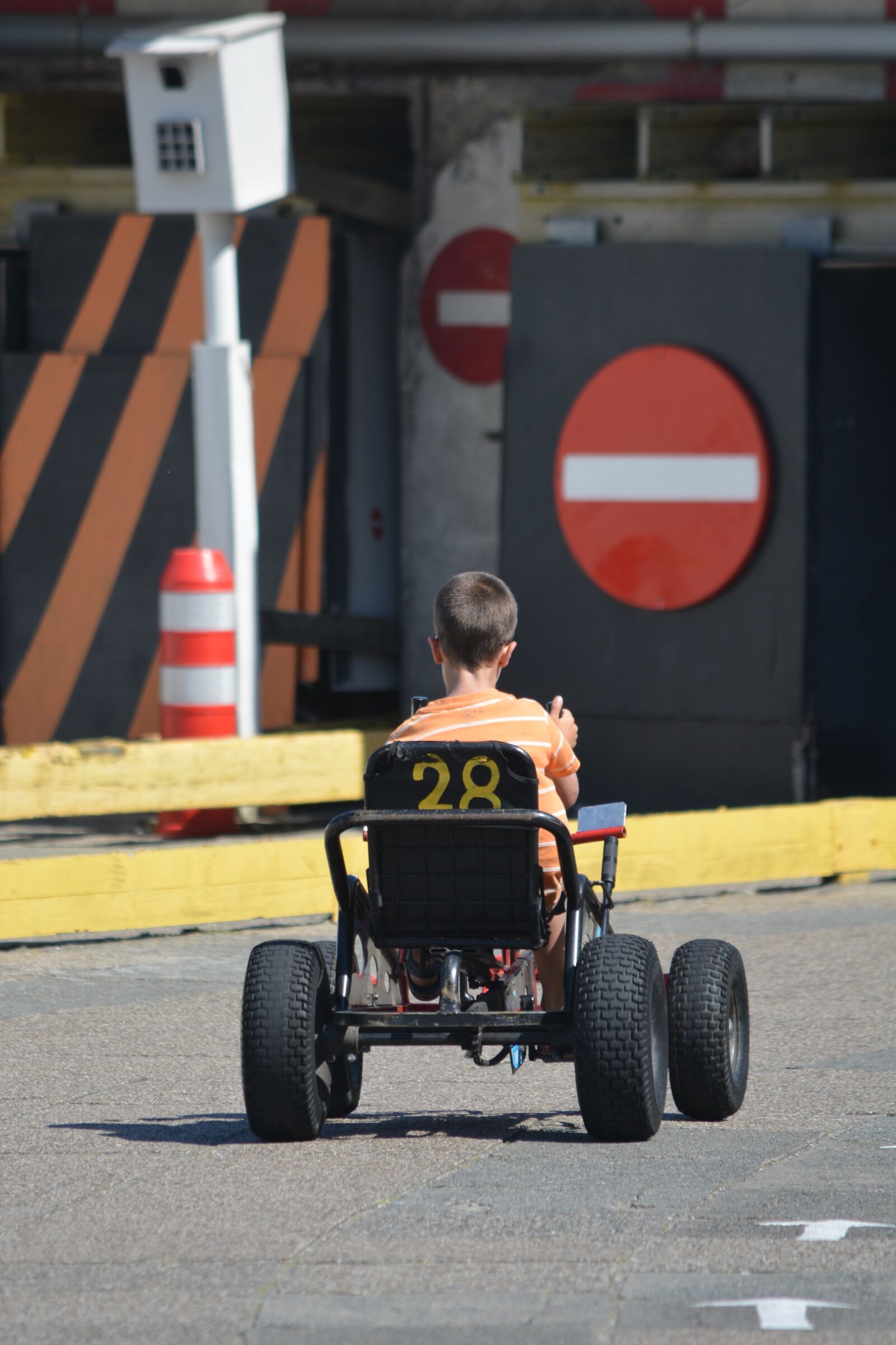 Nikon D5200 sample photo. Child, road sign, speed photography