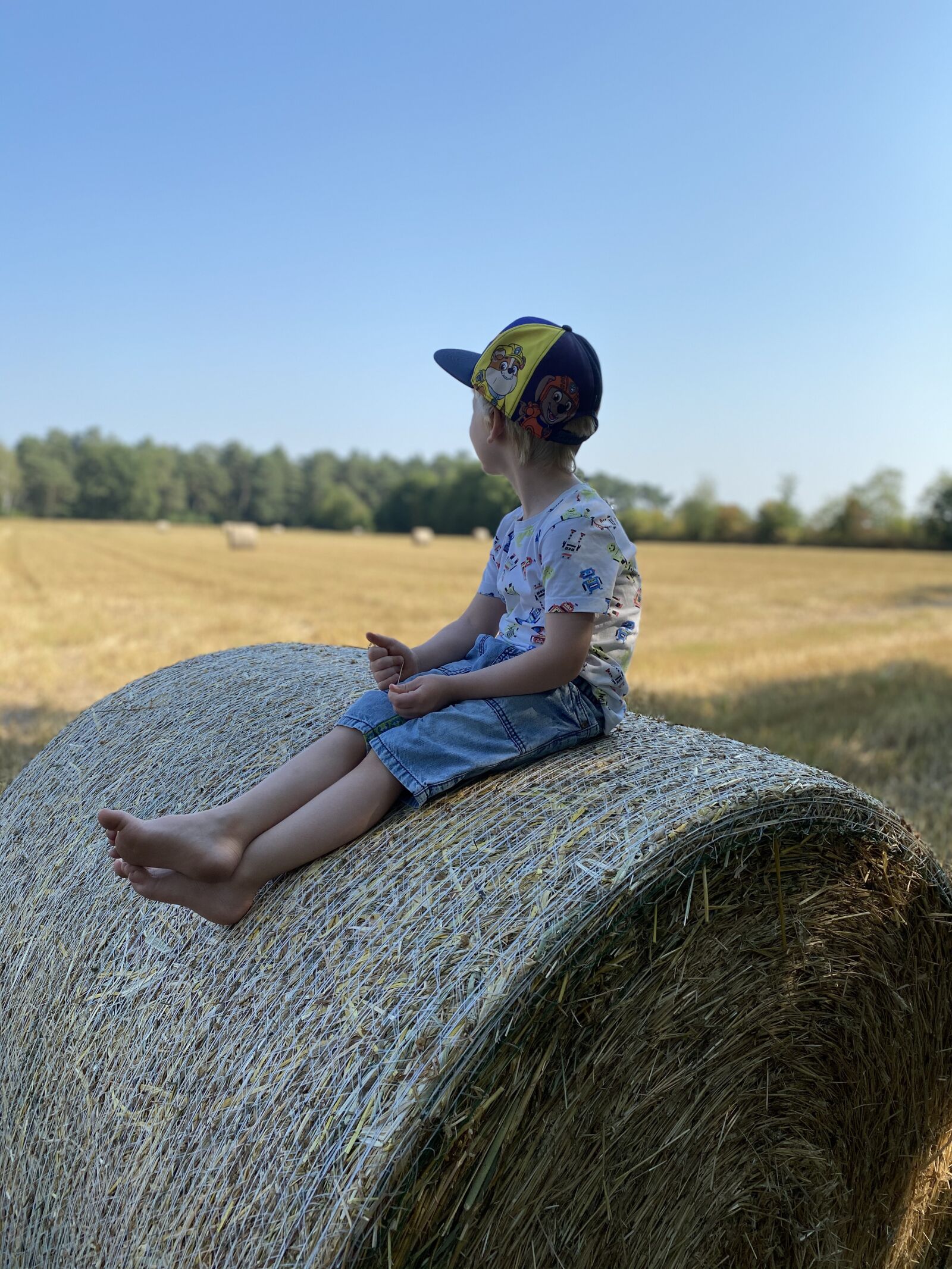 Apple iPhone 11 sample photo. Boy, child, cap photography