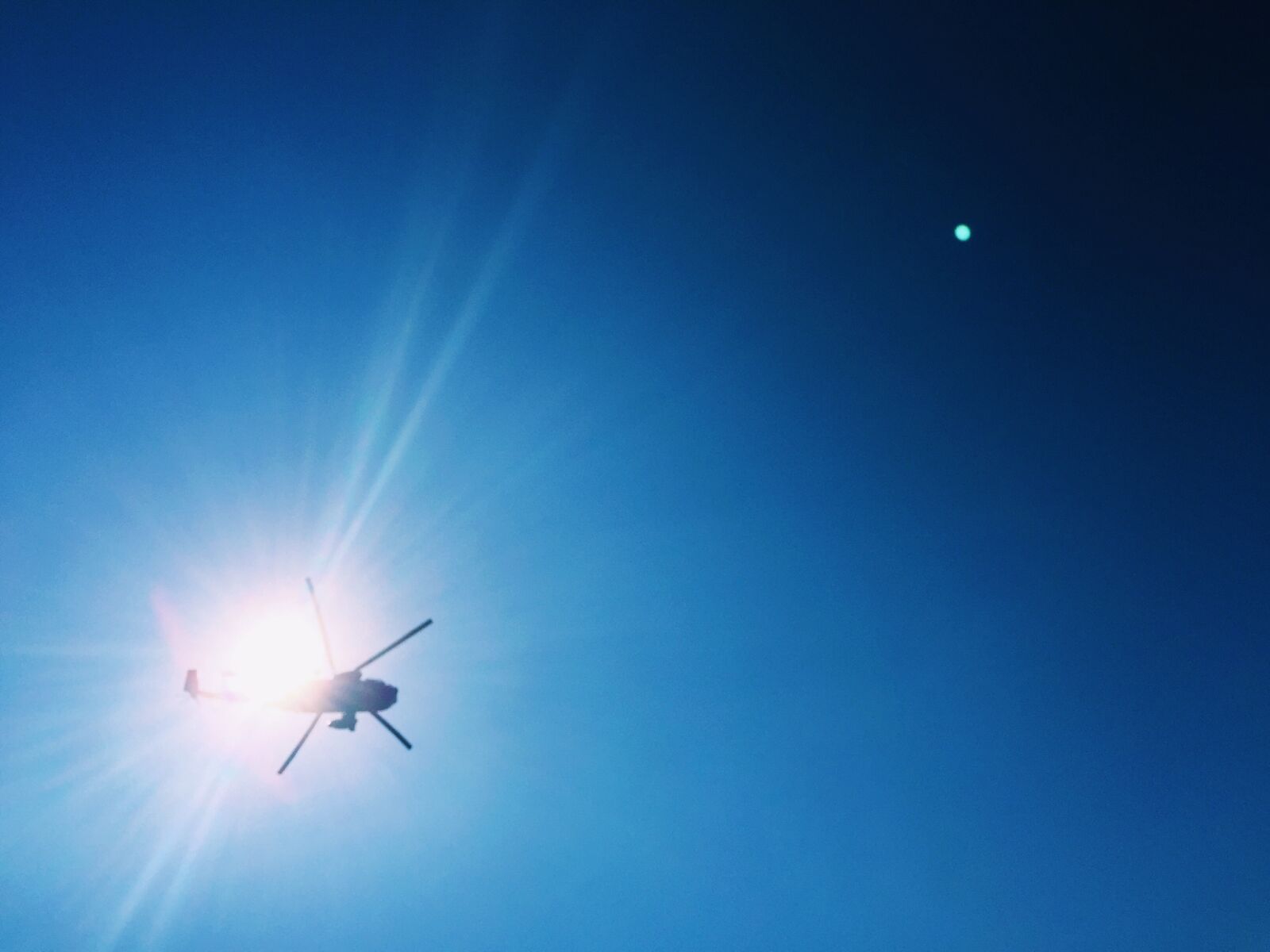 iPhone 6 Plus back camera 4.15mm f/2.2 sample photo. Blue, helicopter, sky, sunglare photography