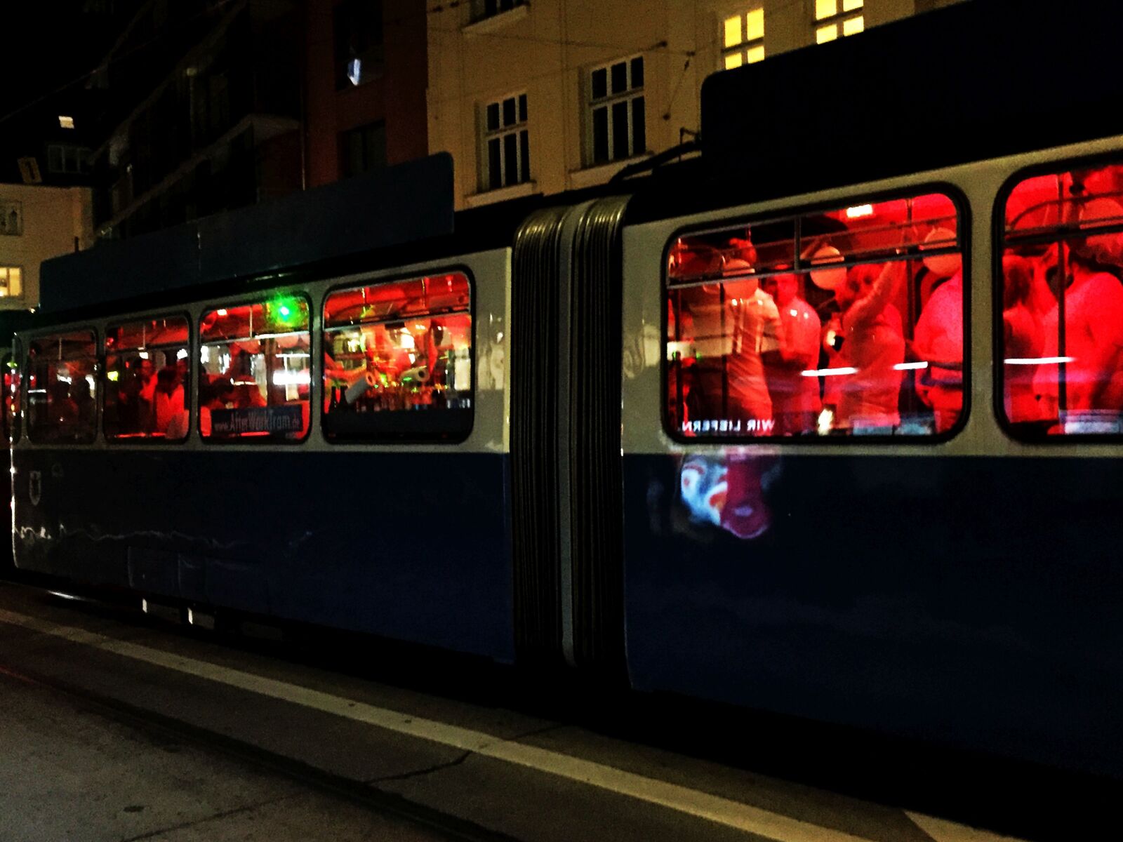 iPhone 6 back camera 4.15mm f/2.2 sample photo. Party, party tram, munich photography