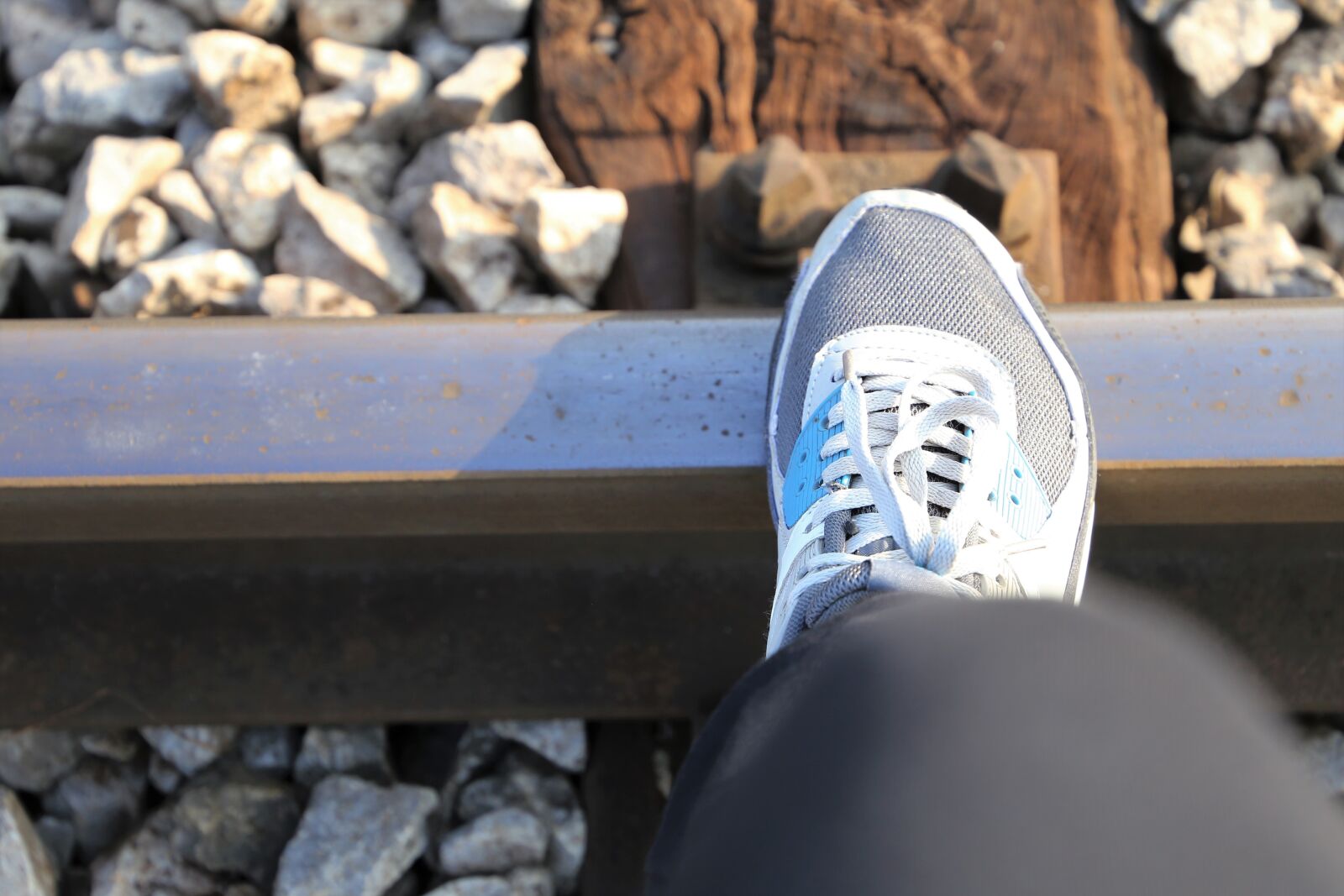 Canon EF 24-105mm F3.5-5.6 IS STM sample photo. Sneaker on railway, rocks photography