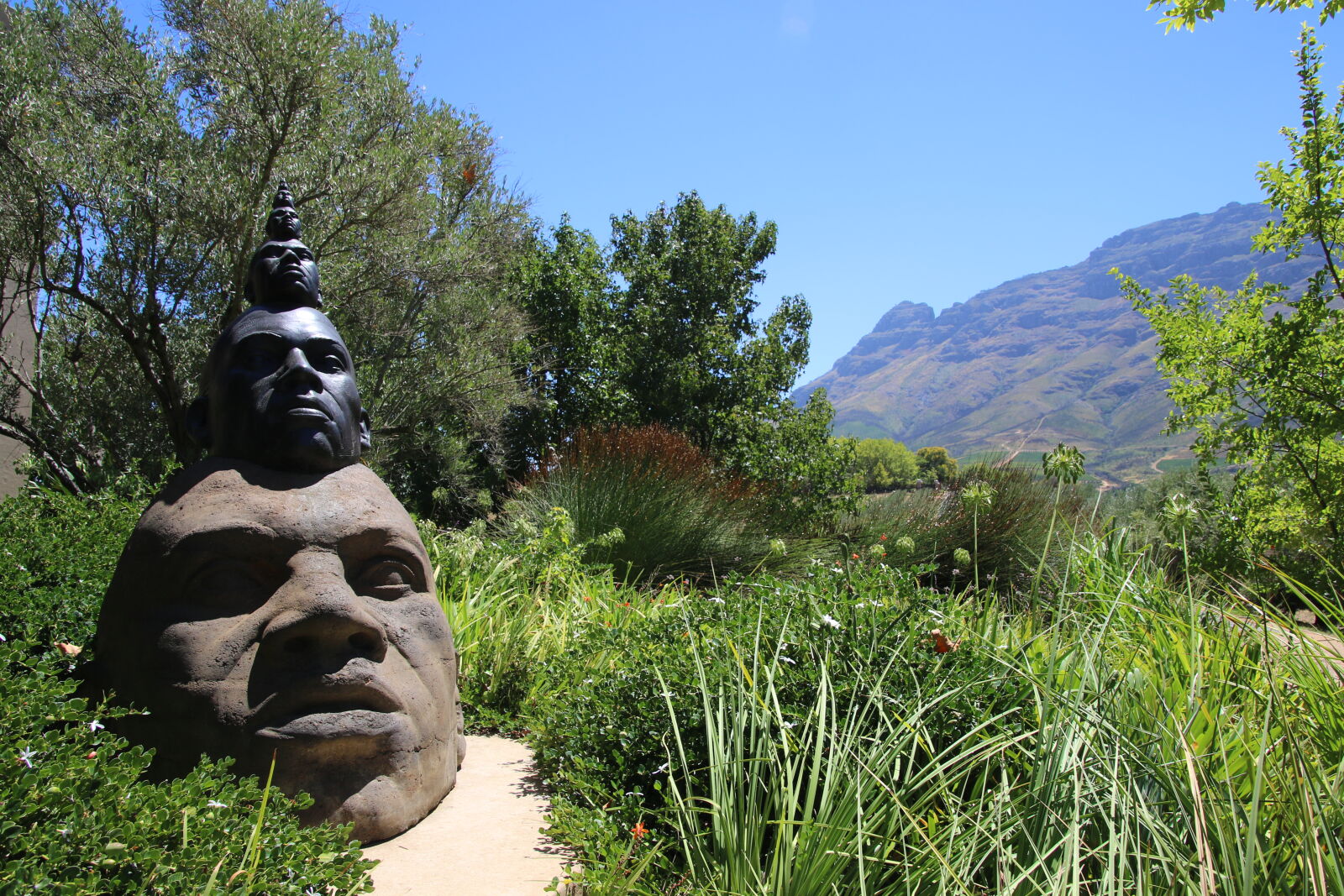 Canon EOS 7D Mark II sample photo. Art, heads, mountains, garden photography