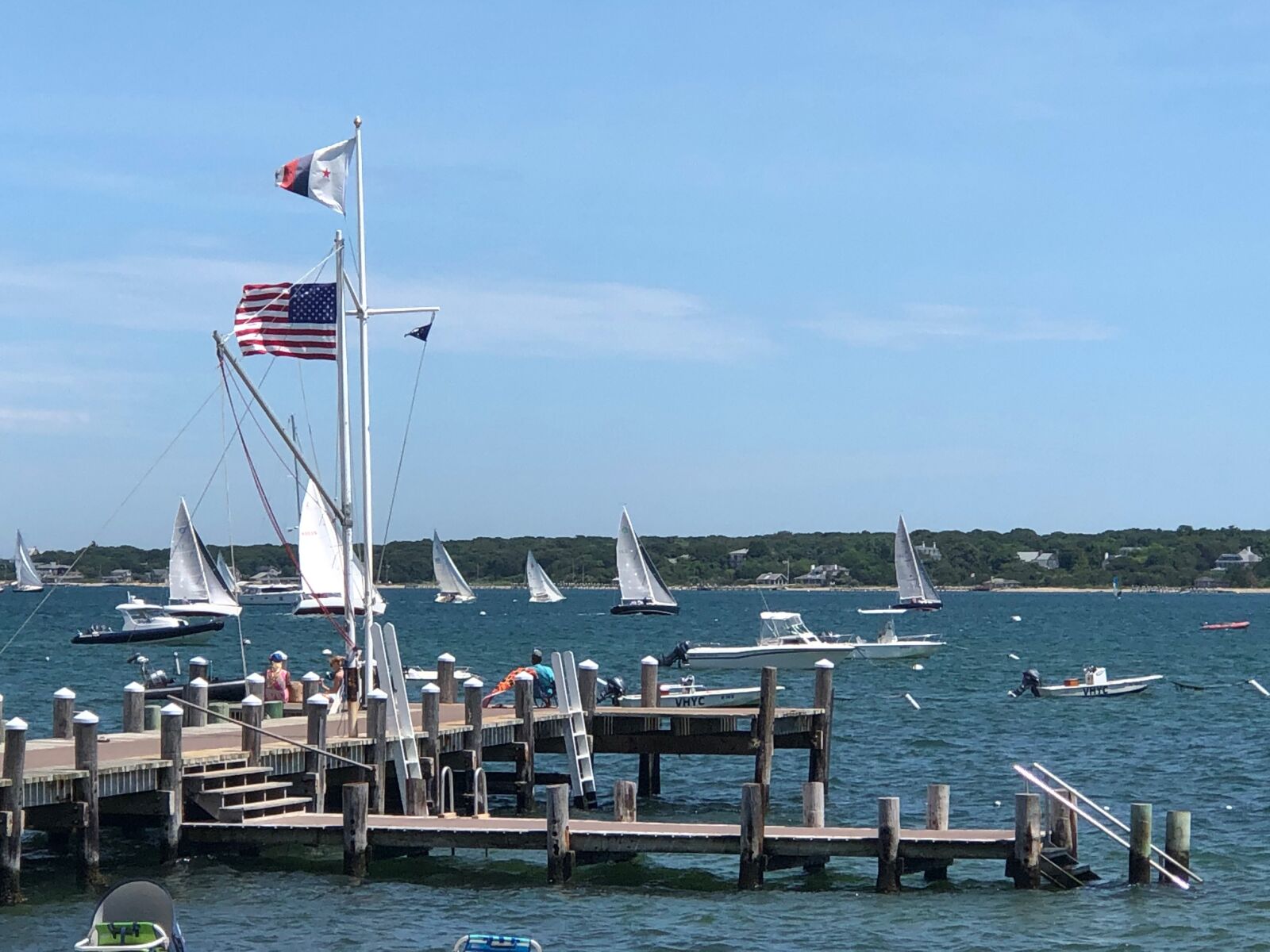 Apple iPhone 8 Plus sample photo. Sailboat, dock, flags photography