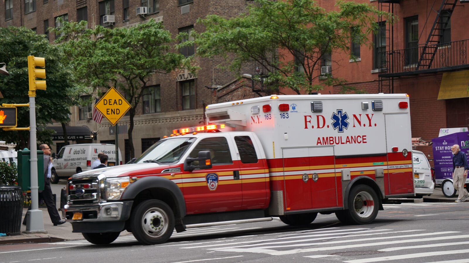 Sony E 55-210mm F4.5-6.3 OSS sample photo. Ambulance, new york, road photography