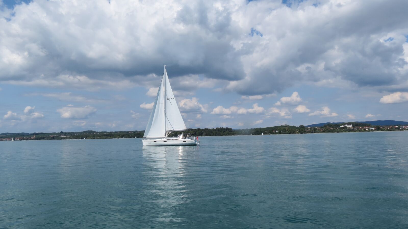Canon PowerShot SX40 HS sample photo. Vacations, boat, clouds photography