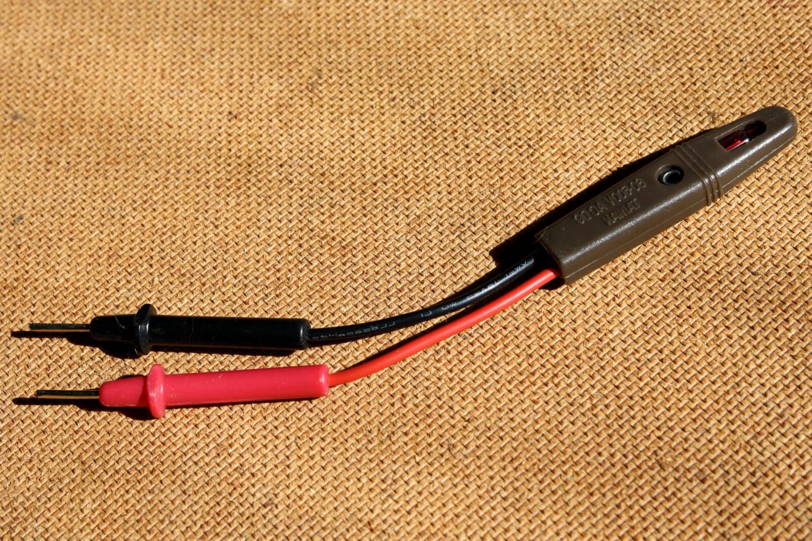 f/3.5-5.6 IS sample photo. Electrical wire, outlet, tester photography
