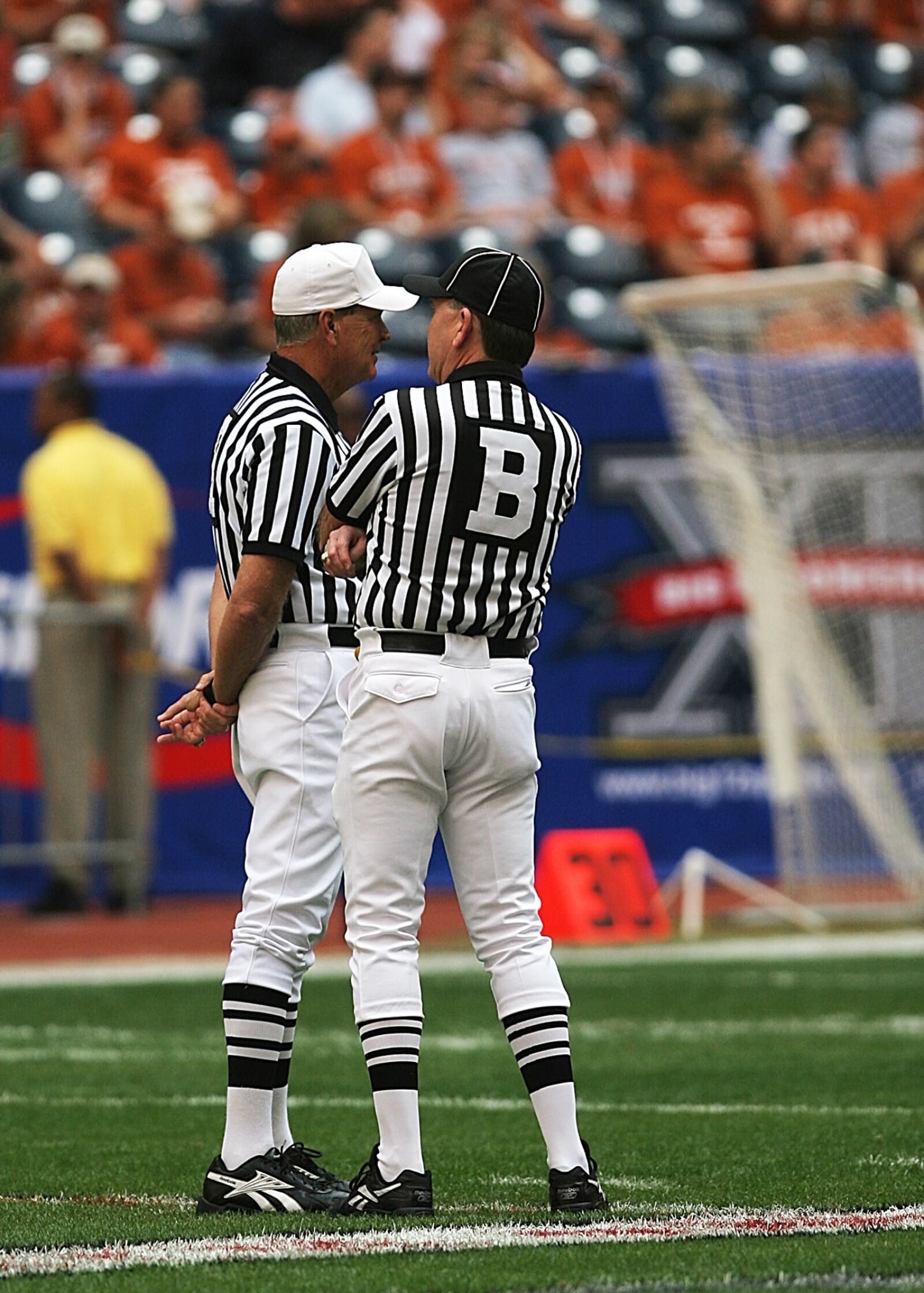 Canon EOS 20D sample photo. Football officials, referees, american photography