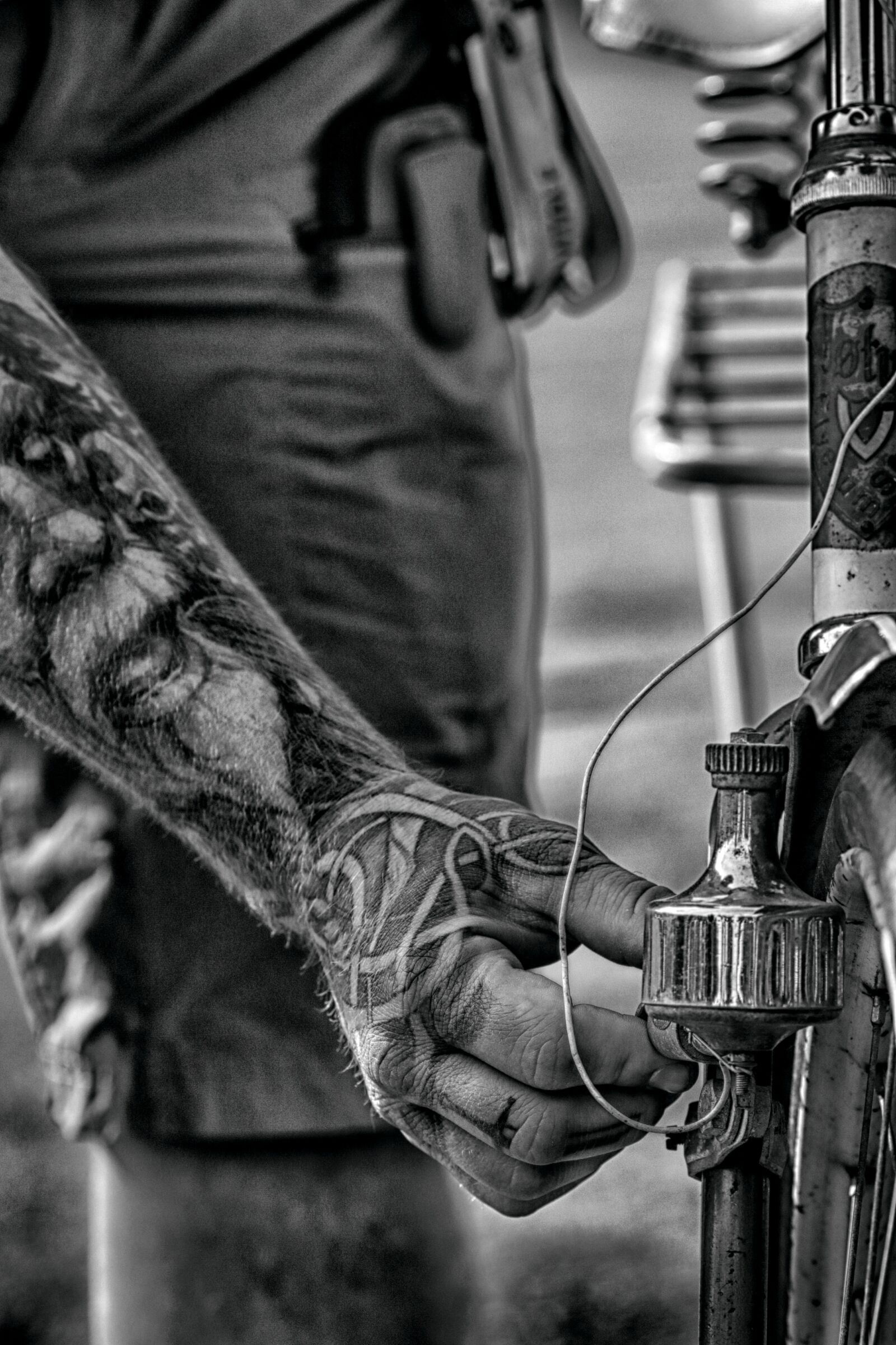 Canon EOS 7D Mark II + Canon EF 135mm F2L USM sample photo. Arm, hand, bike photography