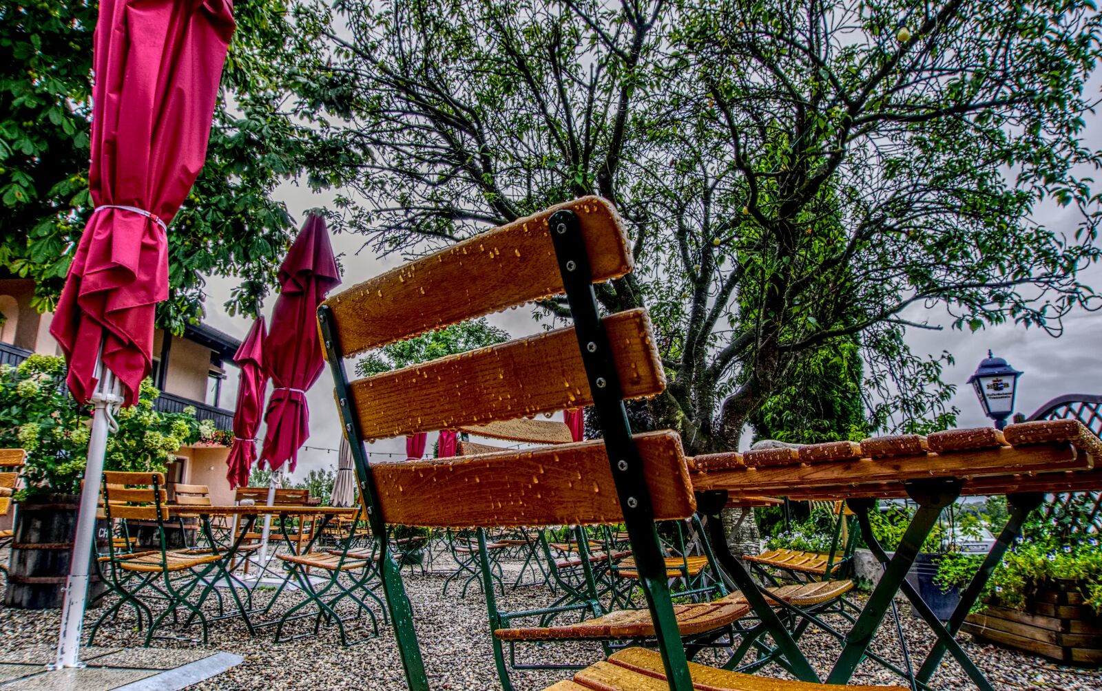 Sony a6000 sample photo. Beer garden, rain, chair photography