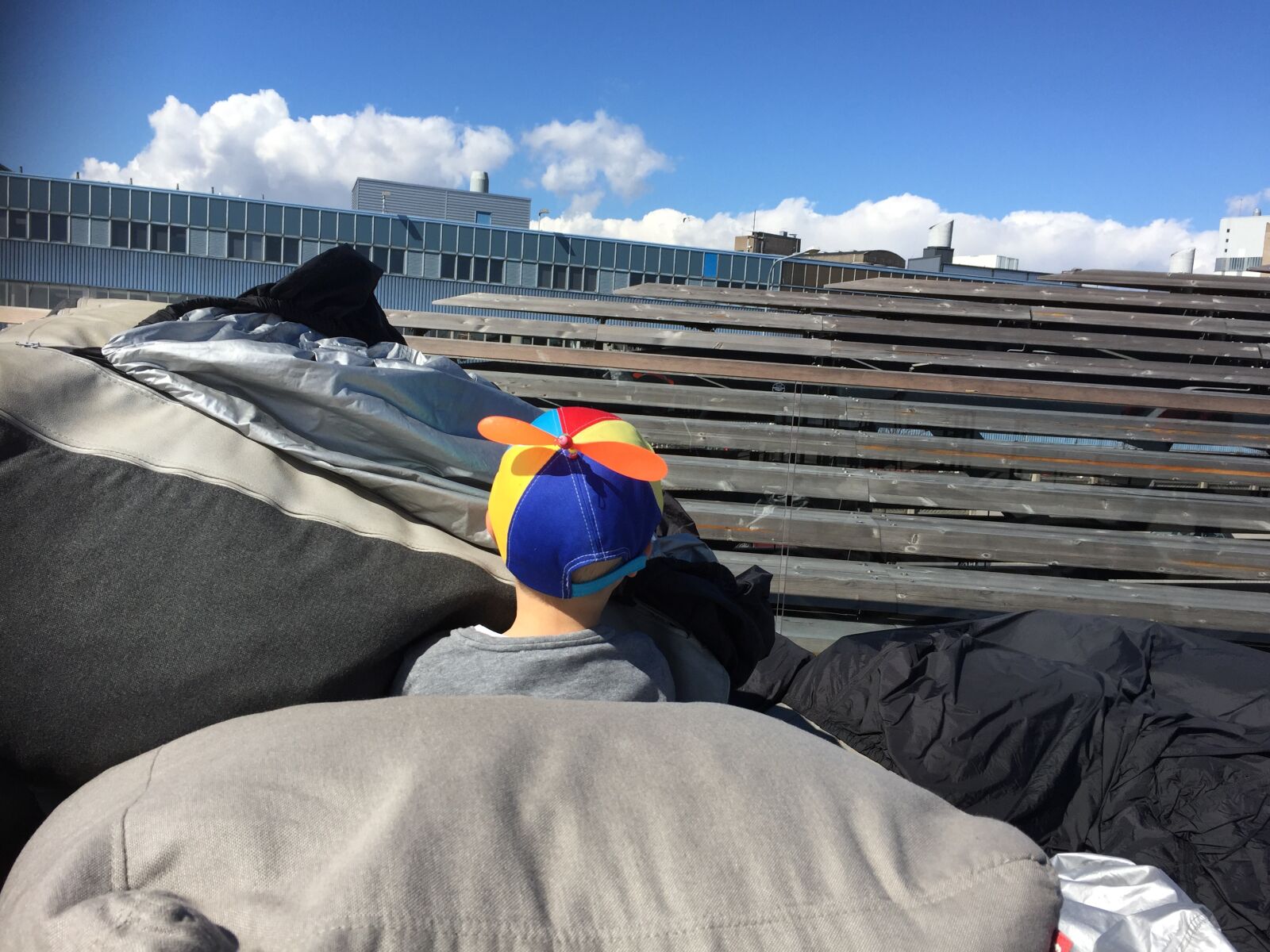 iPhone 6 back camera 4.15mm f/2.2 sample photo. Helsinki, boy, city photography