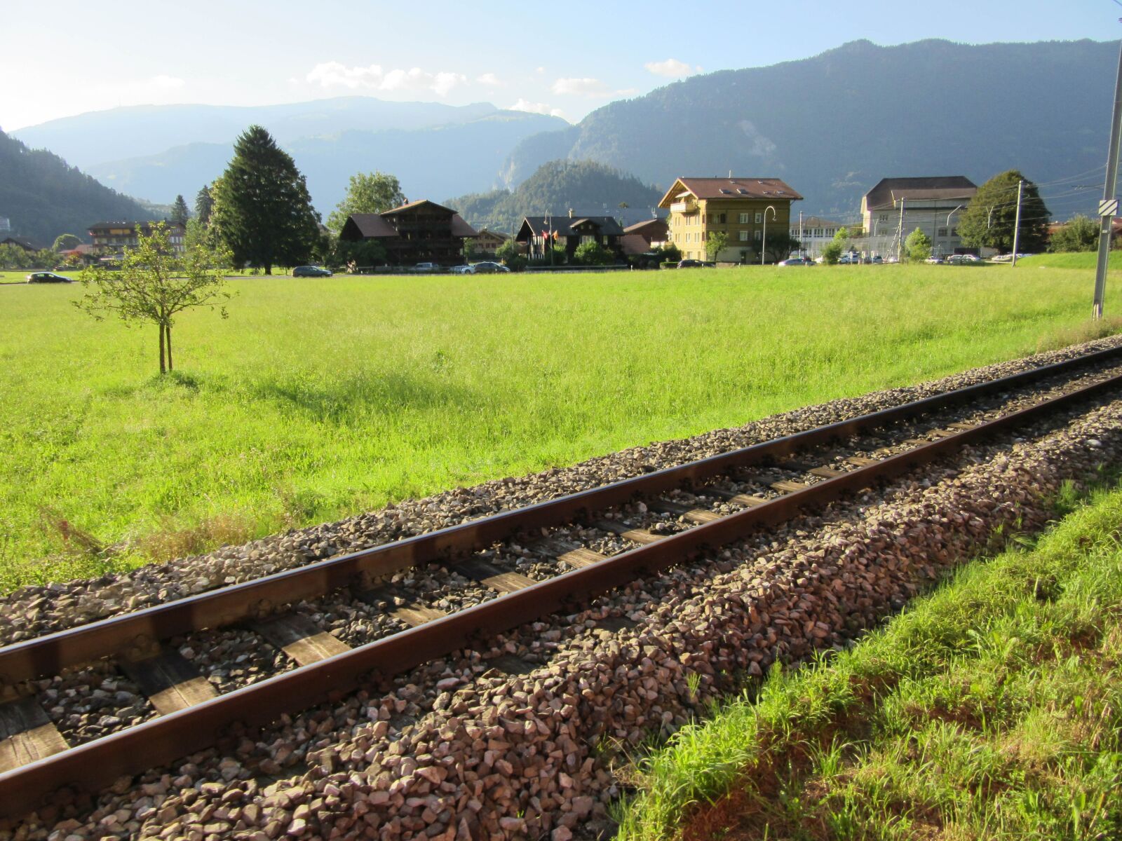 Canon PowerShot SX600 HS sample photo. Switzerland, railway, meadows photography