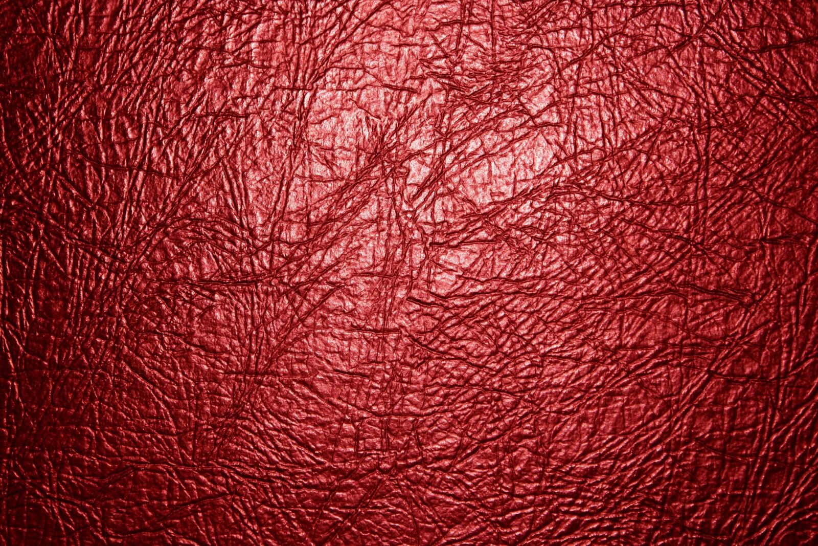 f/3.5-5.6 IS sample photo. Red leather, texture photography