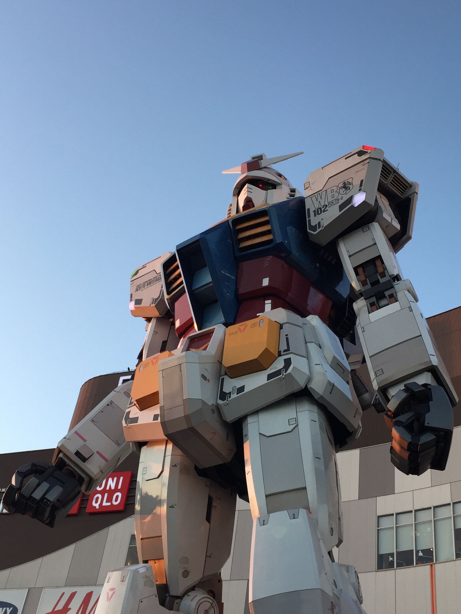 iPhone 6 back camera 4.15mm f/2.2 sample photo. Diver, city, gundam, japan photography