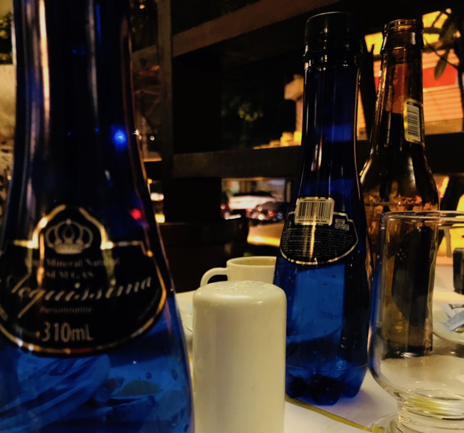 iPhone 7 back camera 3.99mm f/1.8 sample photo. Bar, table, bottle photography