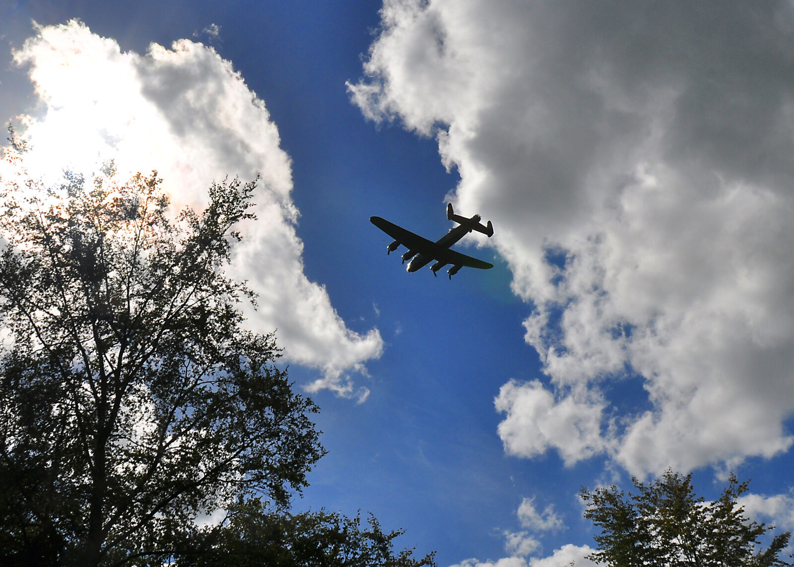 Nikon D90 sample photo. Aeroplane, bomber, clouds, sky photography