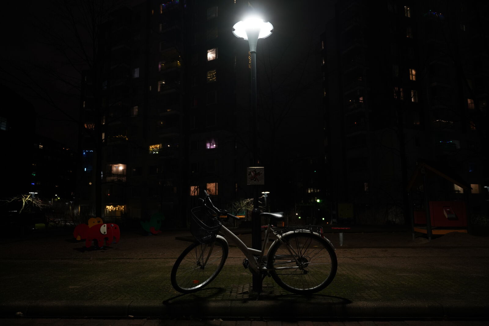 Sigma 24-70mm F2.8 DG DN Art sample photo. Left behind lowlight bicycle photography