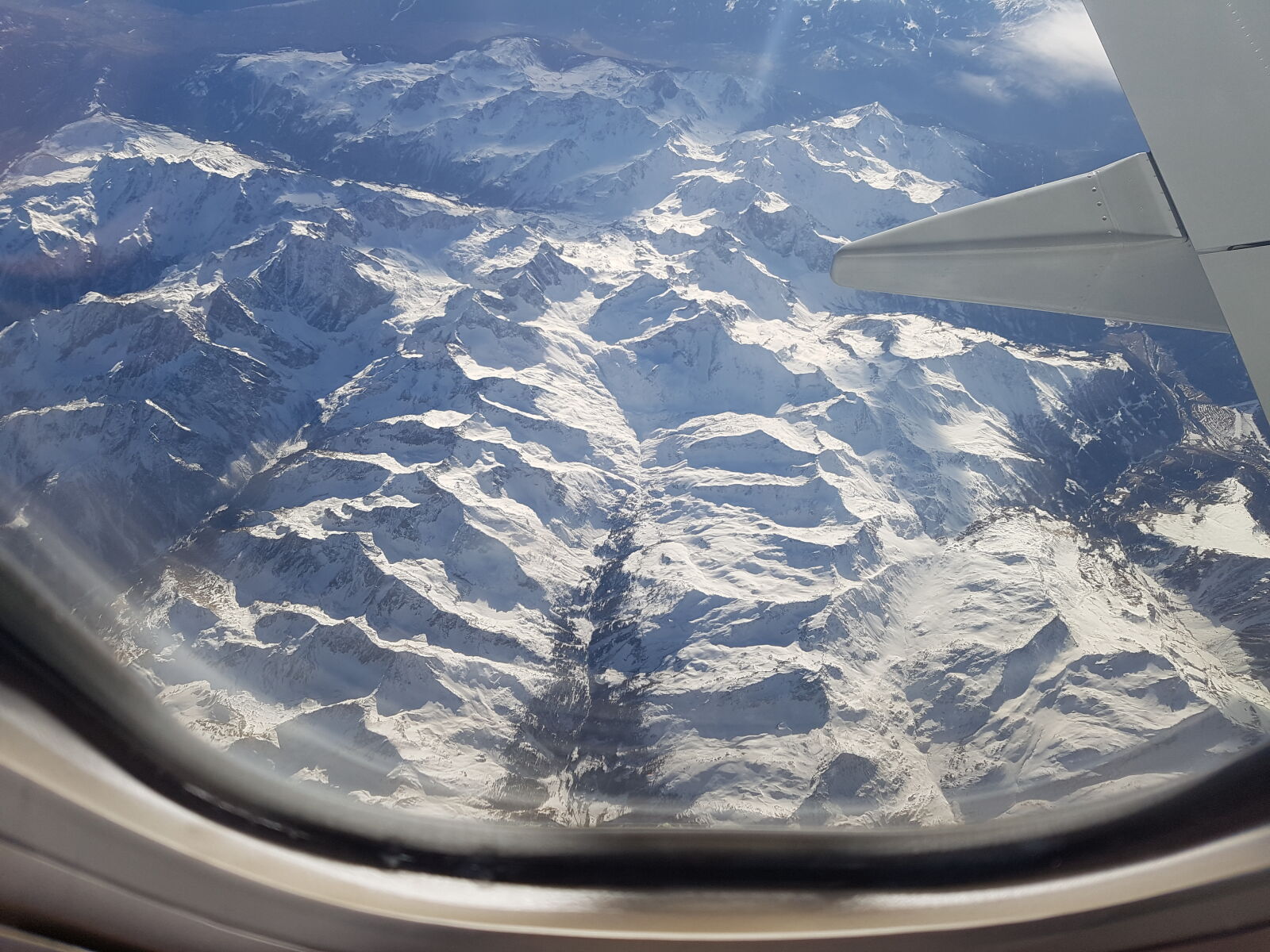 Samsung Galaxy S7 sample photo. On, airplane, above, mountains photography