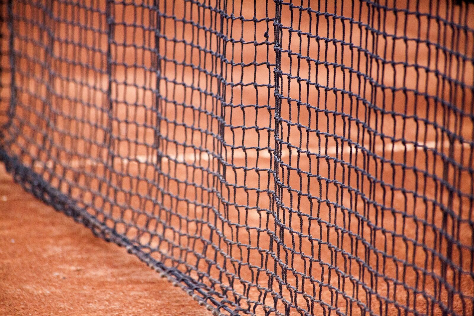 Canon EF 70-300mm F4-5.6 IS USM sample photo. Black network, clay, tennis photography