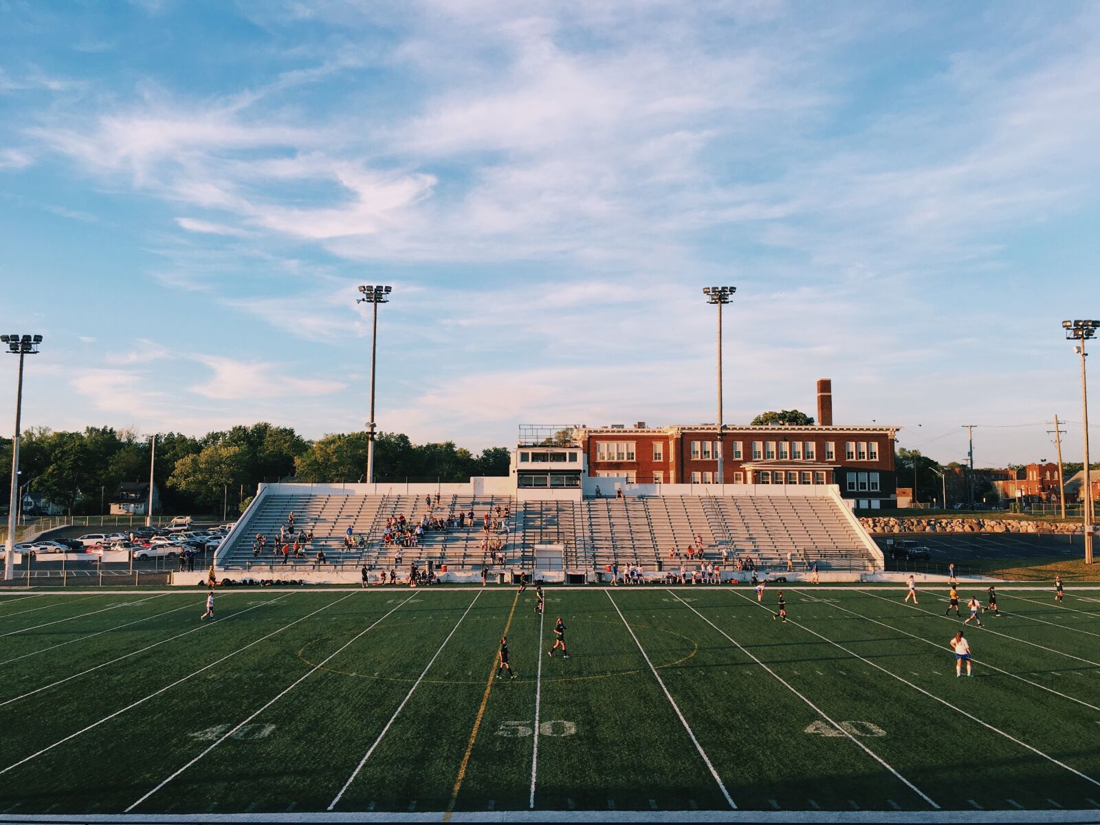 Apple iPhone 6s sample photo. Athletes, bleachers, field photography