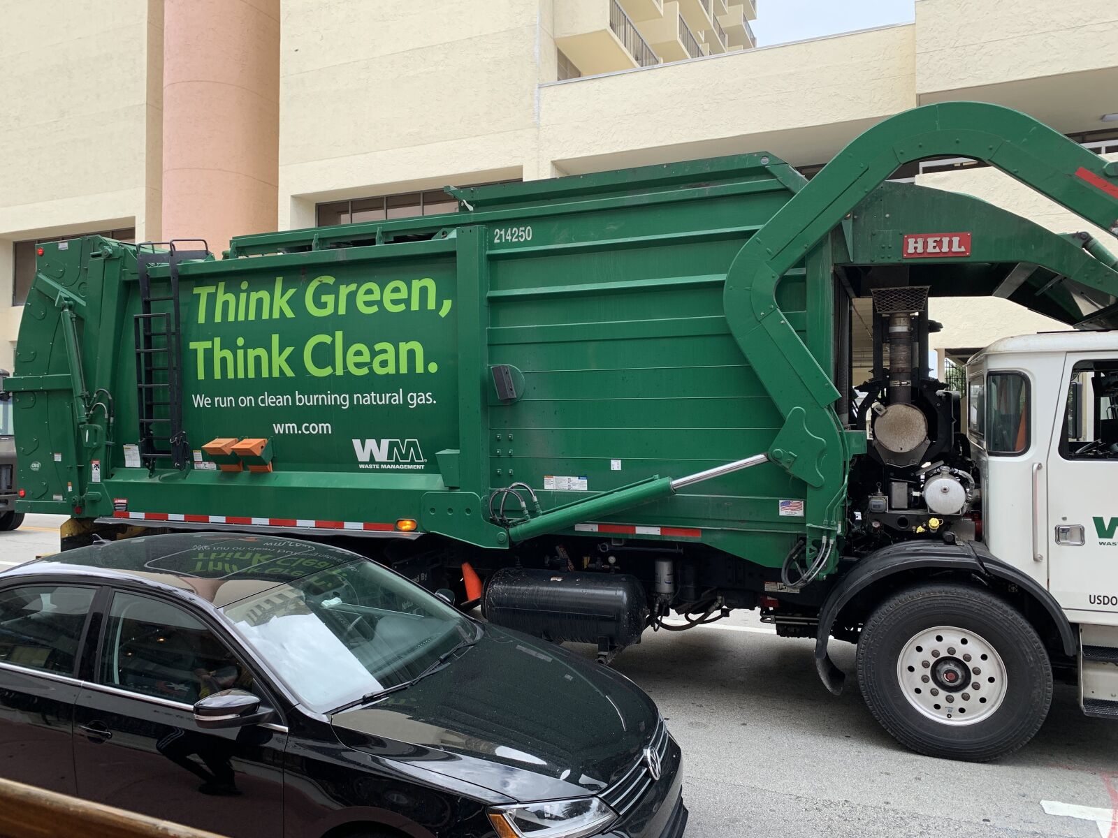 Apple iPhone XR sample photo. Garbage truck, green truck photography