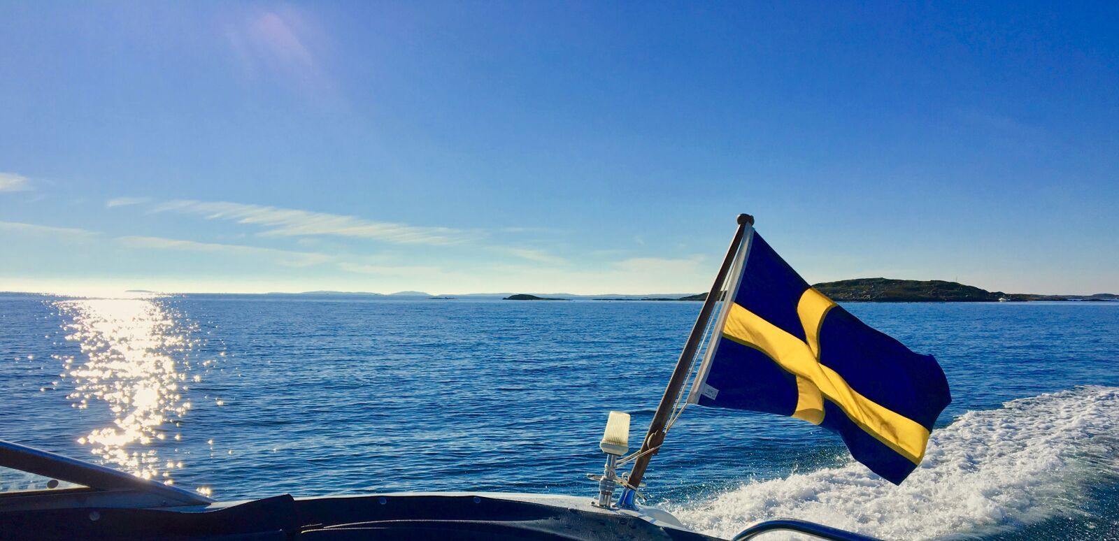 Apple iPhone 6s sample photo. Motorboat, sweden, swedish flag photography