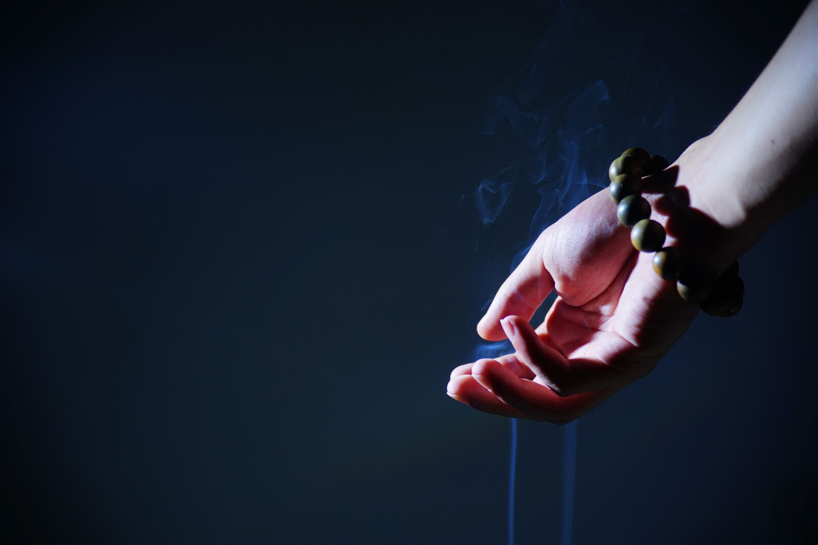 Sony a99 II sample photo. Hand, buddhist prayer beads photography
