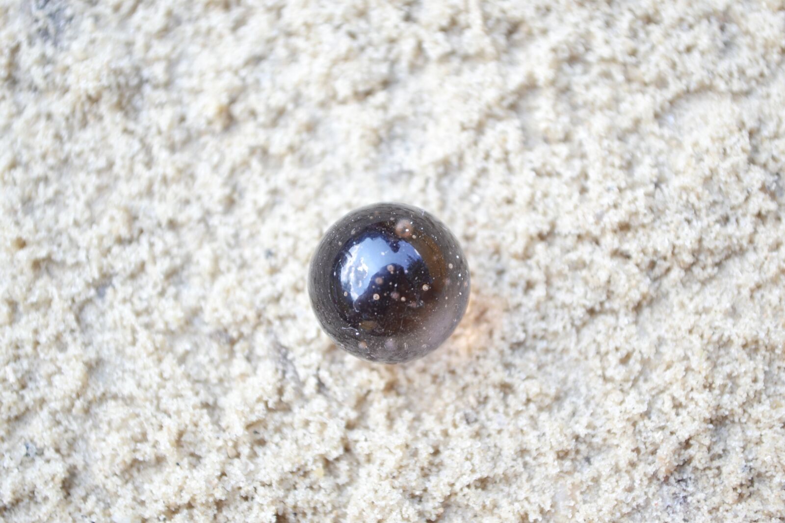 Nikon D3100 sample photo. Marbles, sand, white photography