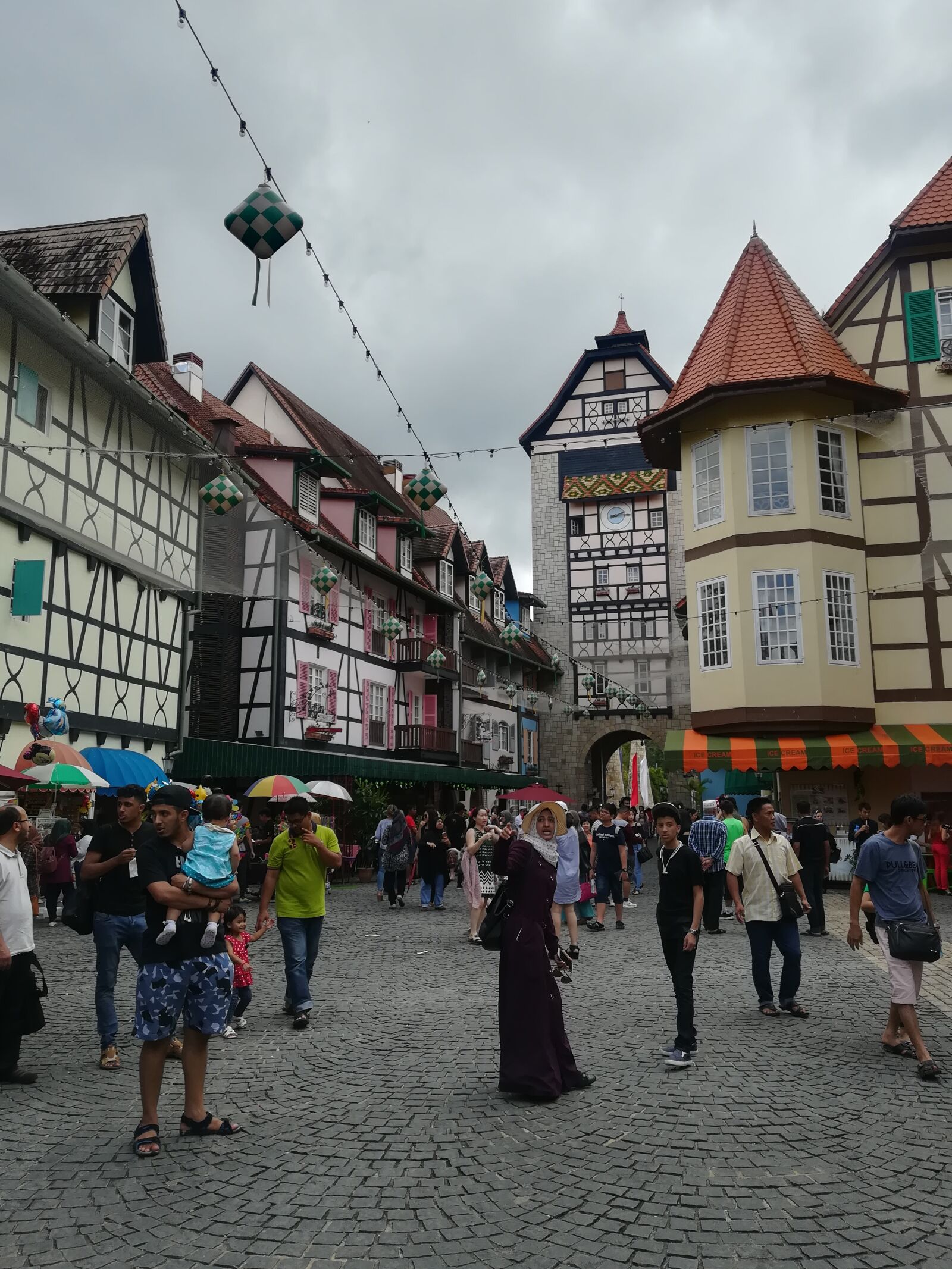 HUAWEI P10 lite sample photo. Buildings, cloudy, crowd, facade photography