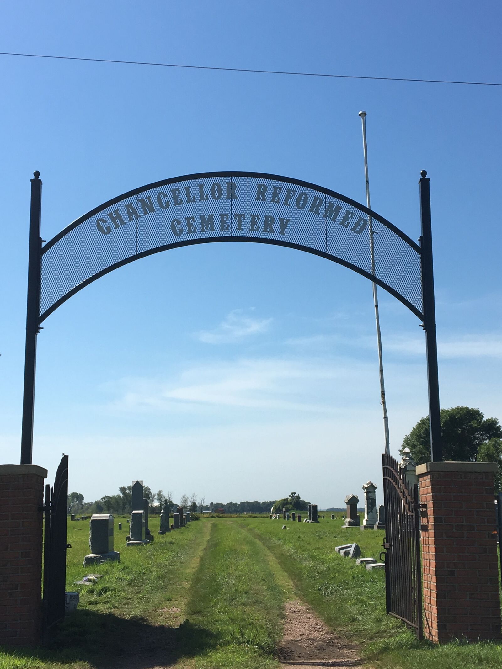 Apple iPhone 6s sample photo. Cemetery, sign, gate photography