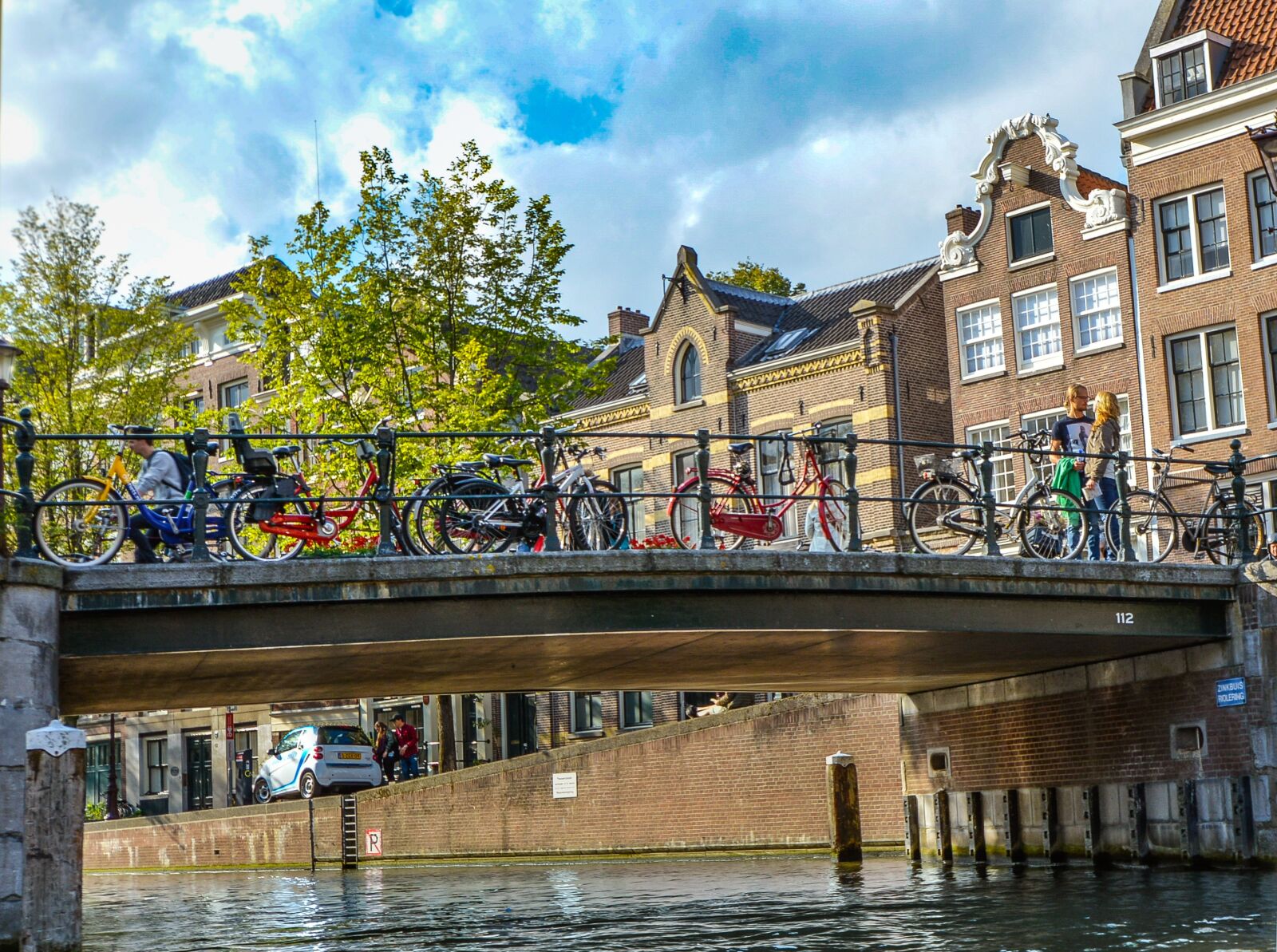 Nikon D5200 sample photo. Amsterdam, bridge, bicycles photography