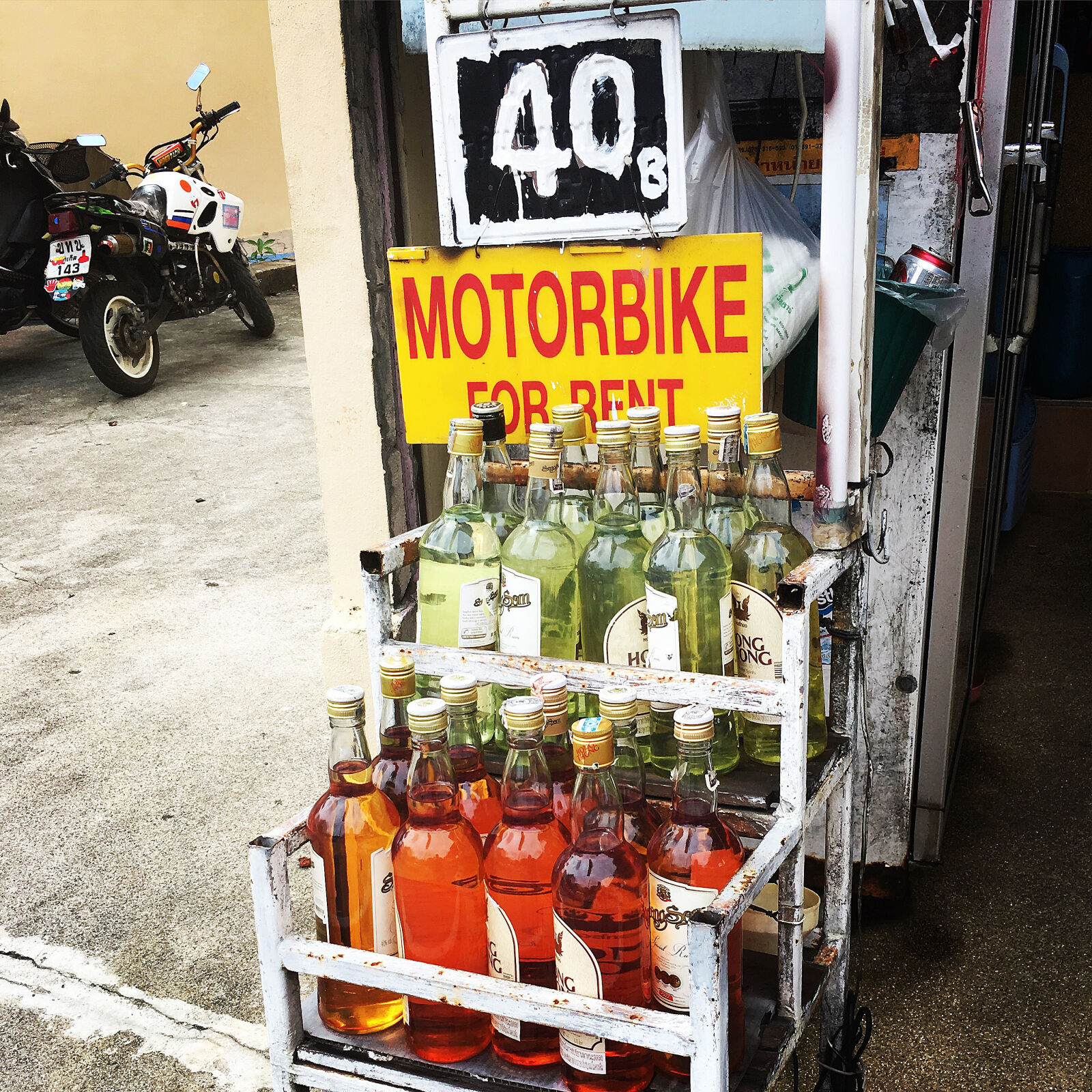iPhone 6s Plus back camera 4.15mm f/2.2 sample photo. Baht, bottles, gasoline, motorbike photography