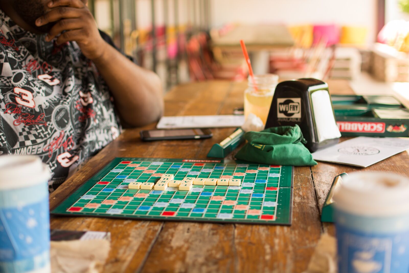 Nikon D5200 sample photo. Old woman, cafe, playing photography