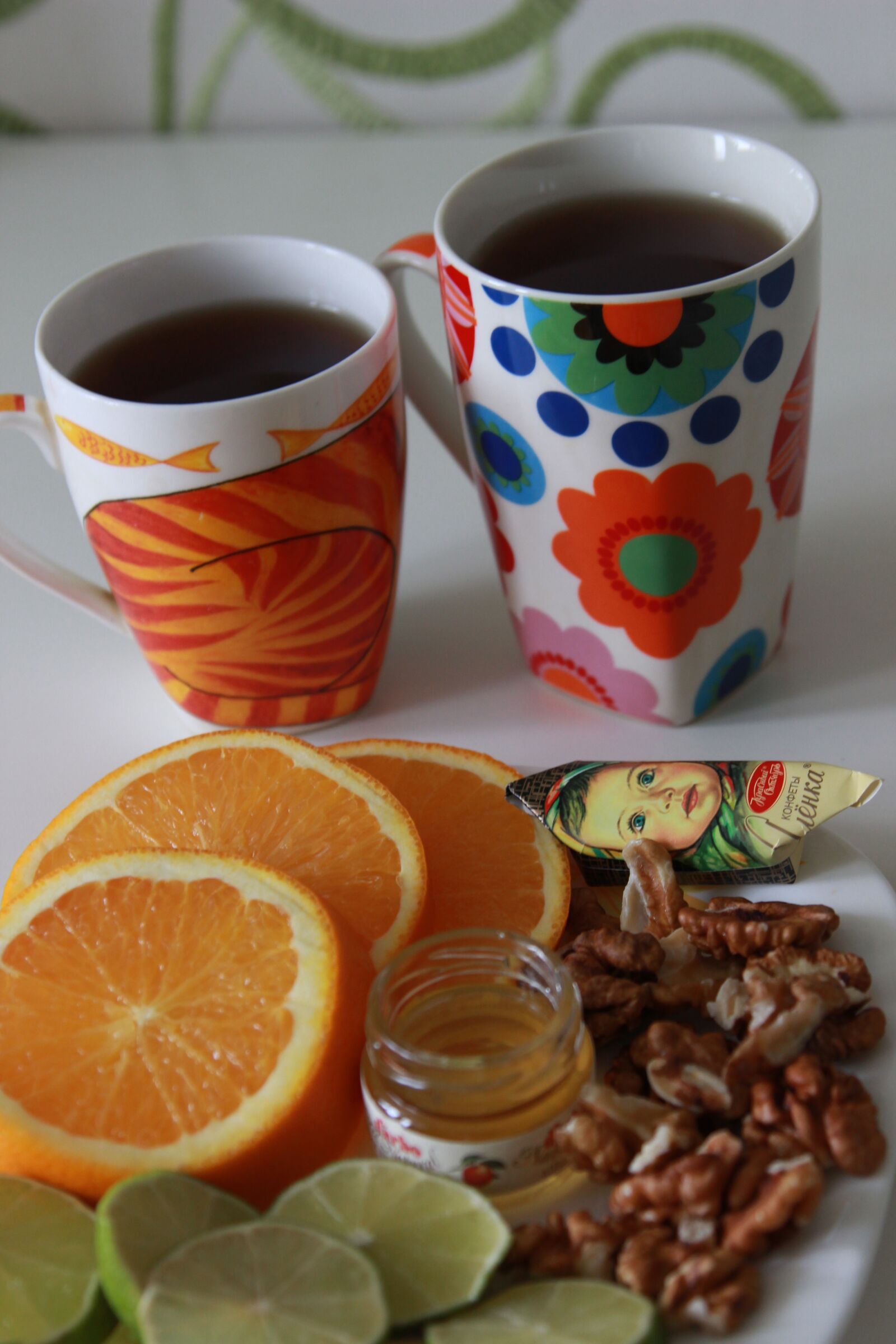 Canon EOS 600D (Rebel EOS T3i / EOS Kiss X5) + Canon EF 24-105mm F4L IS USM sample photo. Tea time, orange, table photography