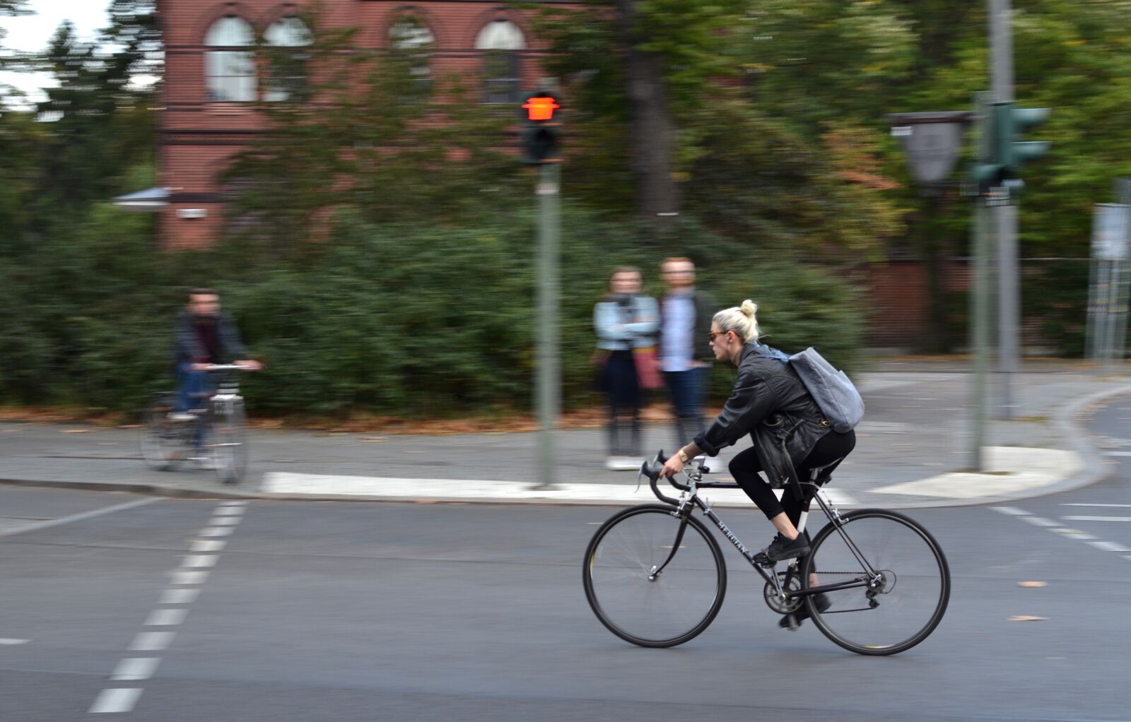 Nikon D3100 sample photo. Bike, girl, panning photography