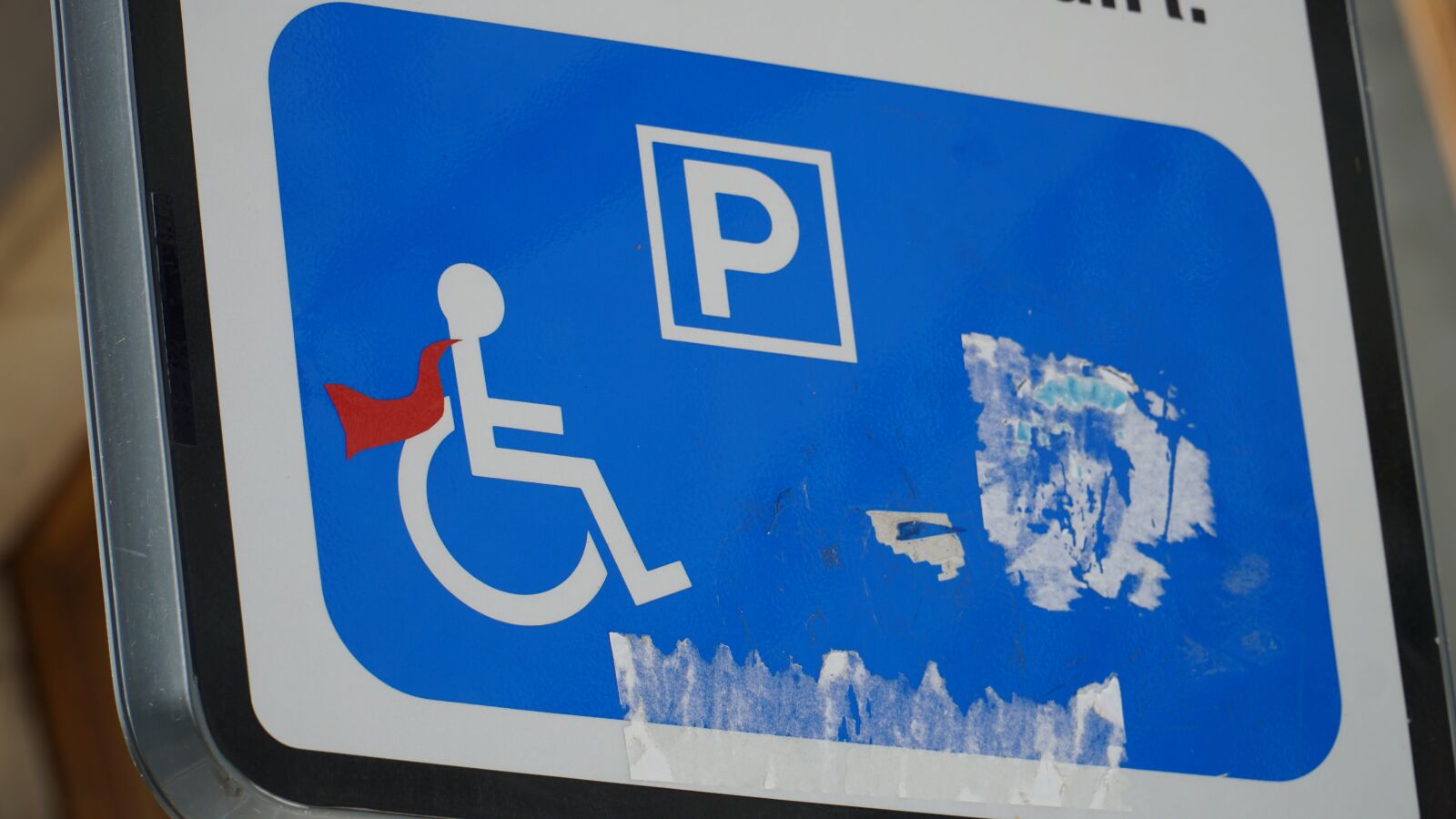 Sony a6000 + Sony E PZ 18-105mm F4 G OSS sample photo. Traffic sign, modified, handicapped photography