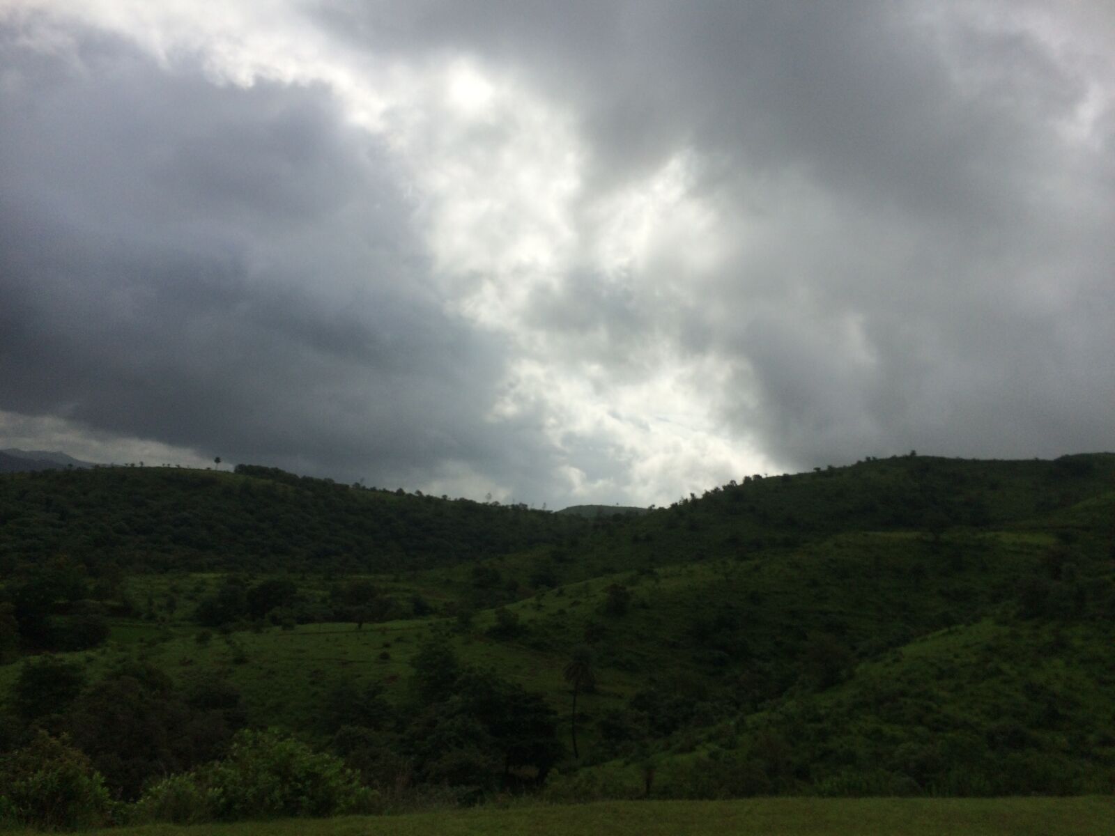 iPhone 5s back camera 4.15mm f/2.2 sample photo. Black clouds, mountains, travel photography