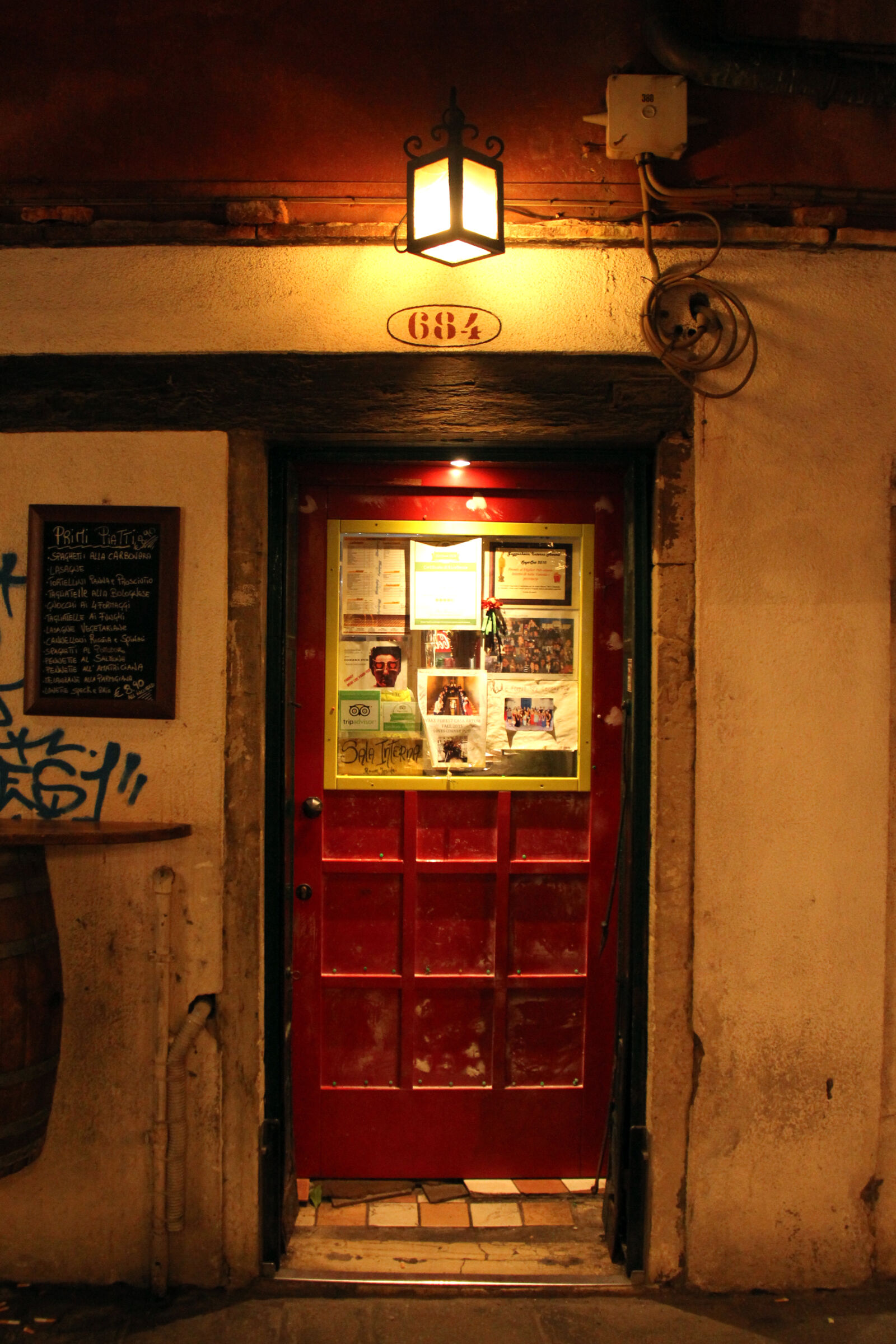Canon EF-S 18-200mm F3.5-5.6 IS sample photo. Bar, door, italy, light photography