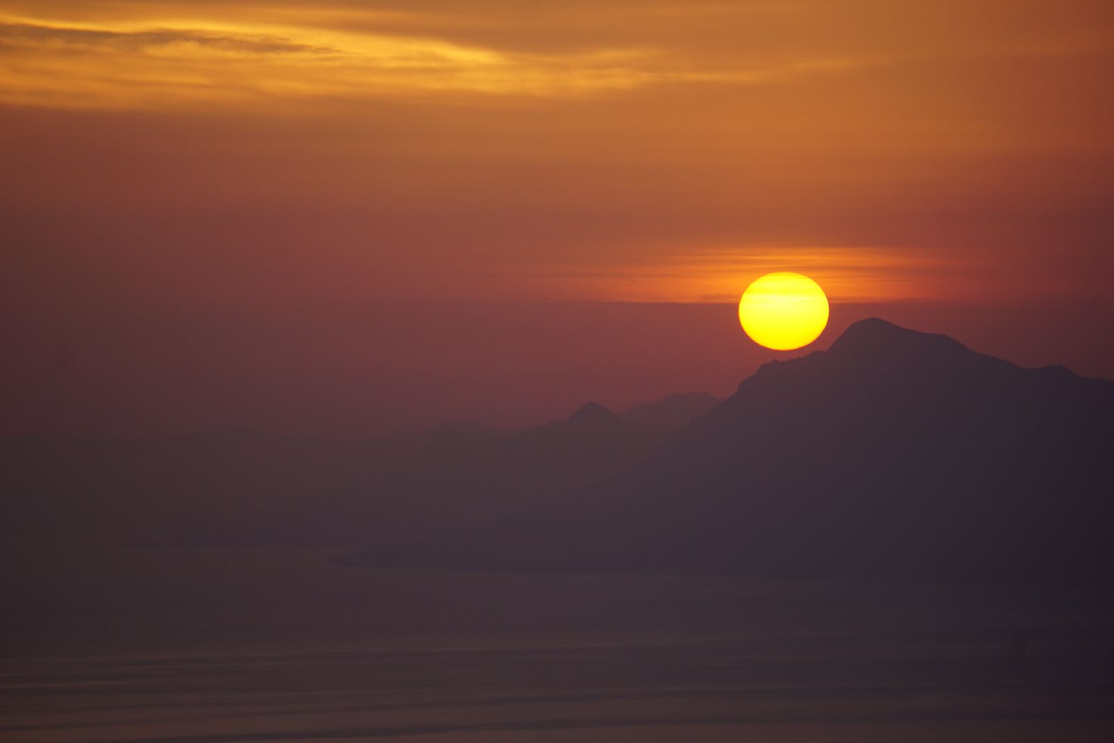 Sony E 55-210mm F4.5-6.3 OSS sample photo. Sea, sunset, mountains photography