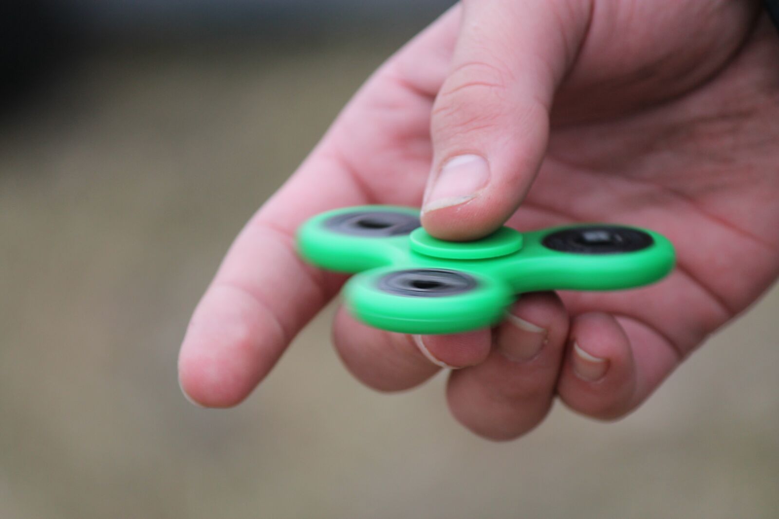 Canon EF-S 55-250mm F4-5.6 IS II sample photo. Fidget spinner, mental health photography