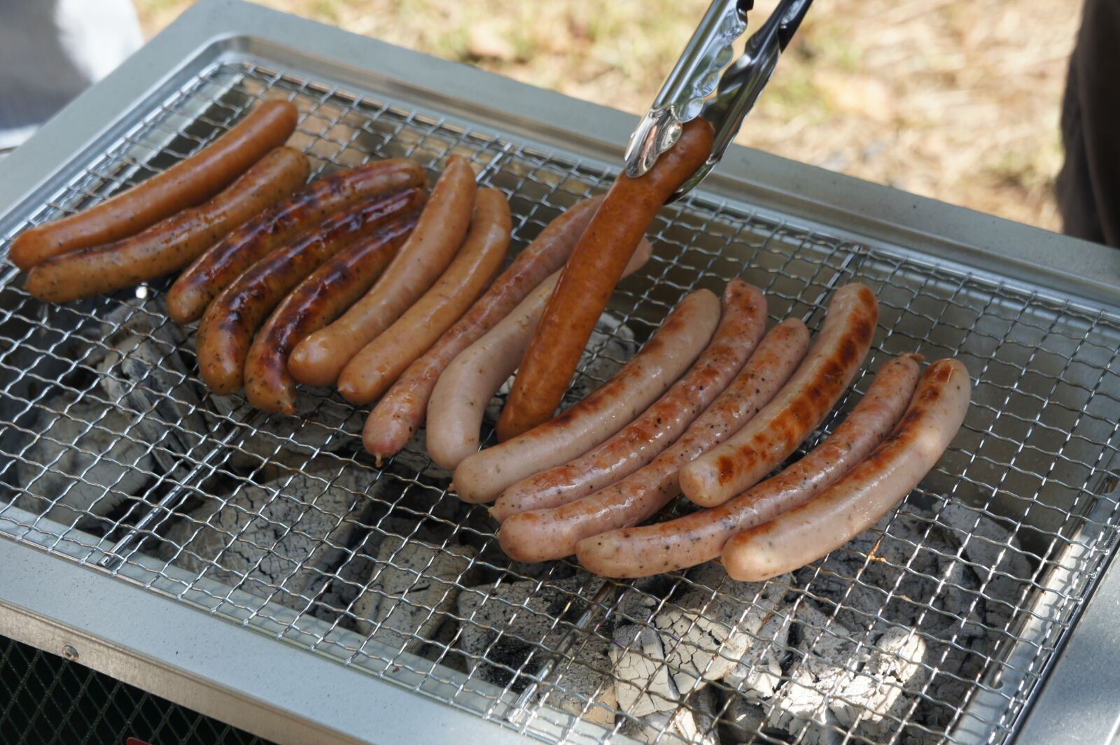 Sony Alpha NEX-5 + Sony E 18-55mm F3.5-5.6 OSS sample photo. Bbq, sausage, full photography