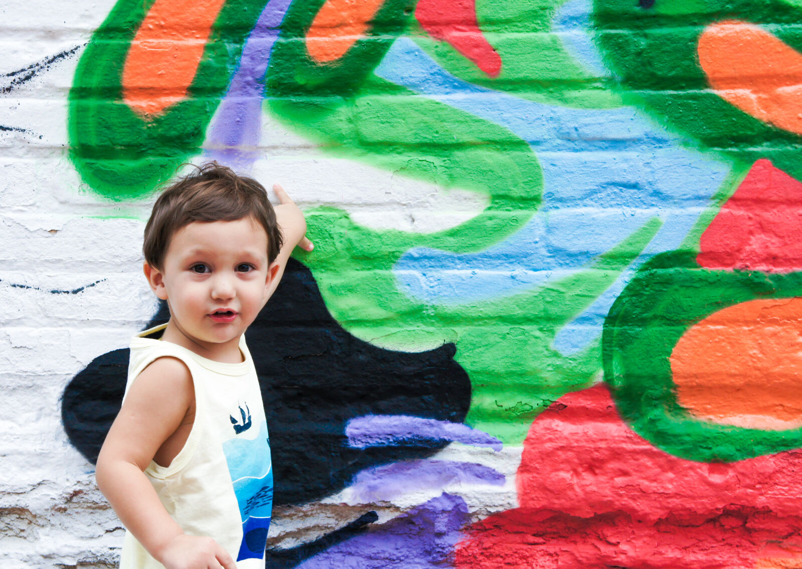 Sony Alpha NEX-3 + Sony E 18-55mm F3.5-5.6 OSS sample photo. Baby, boy, brick, wall photography