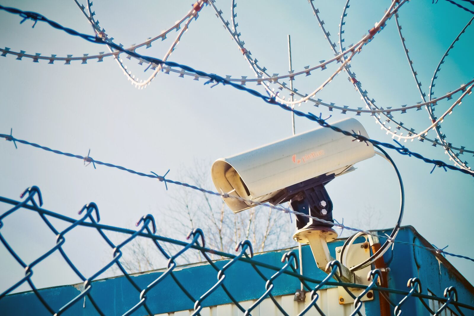 Olympus OM-D E-M10 sample photo. Barbed wire, video camera photography