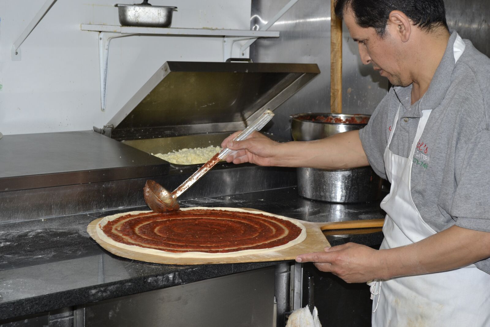 Nikon D3100 sample photo. Pizza, making pizza, pizza photography