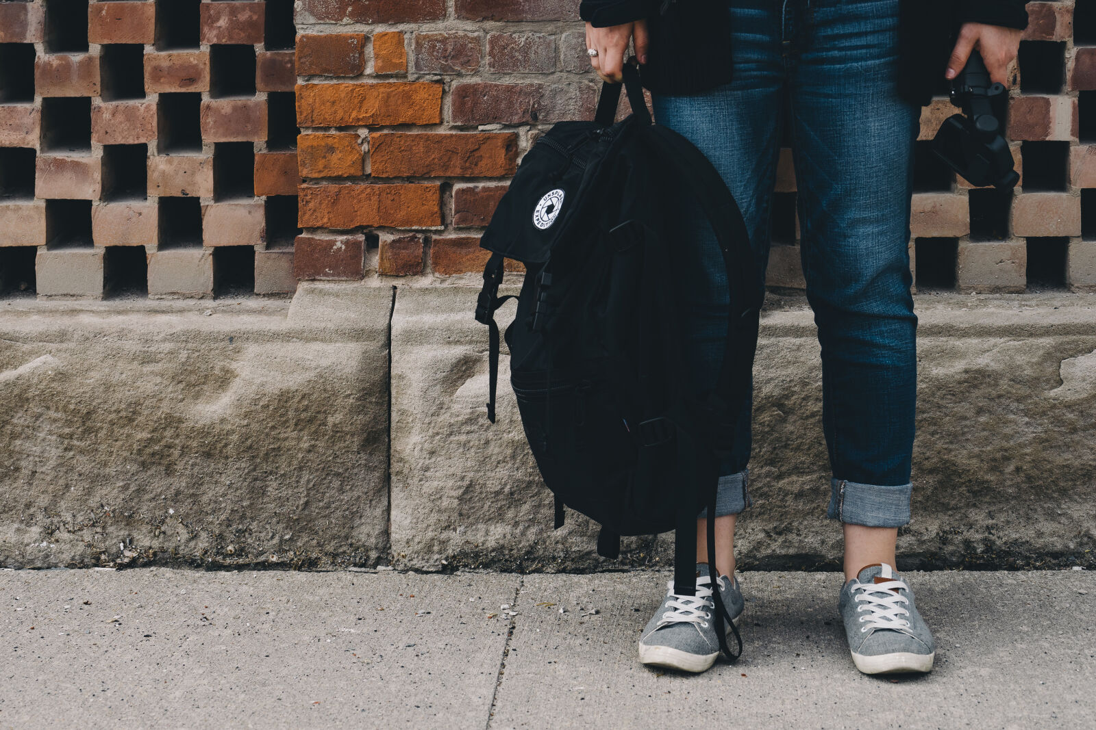 Sony a7 II + Sony FE 28-70mm F3.5-5.6 OSS sample photo. Bricks, outdoors, pants, pavement photography