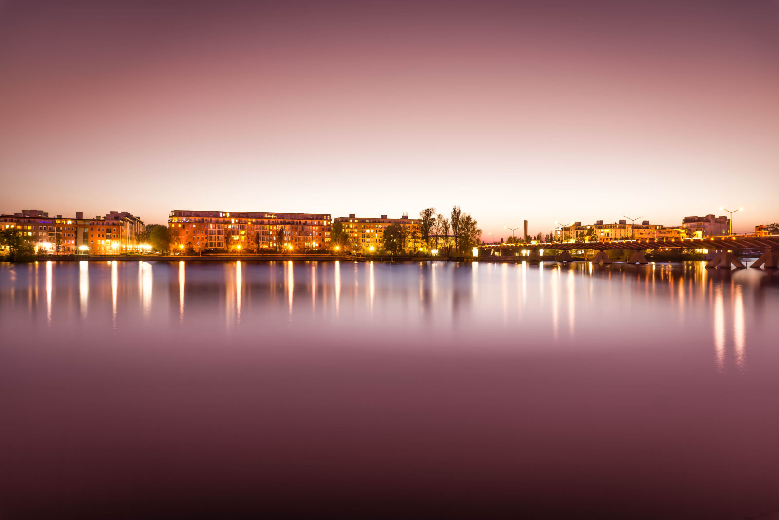 Sony a6000 sample photo. Brown, lighted, buildings, near photography
