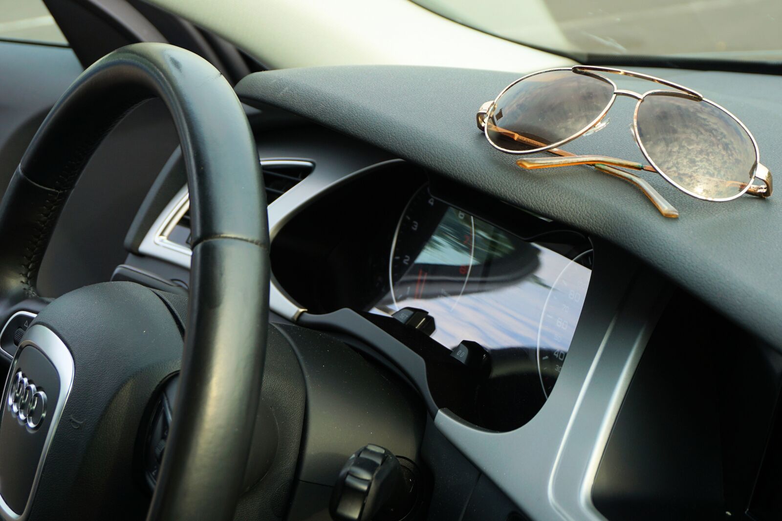 Sony a6000 sample photo. Sunglasses, audi, steering wheel photography