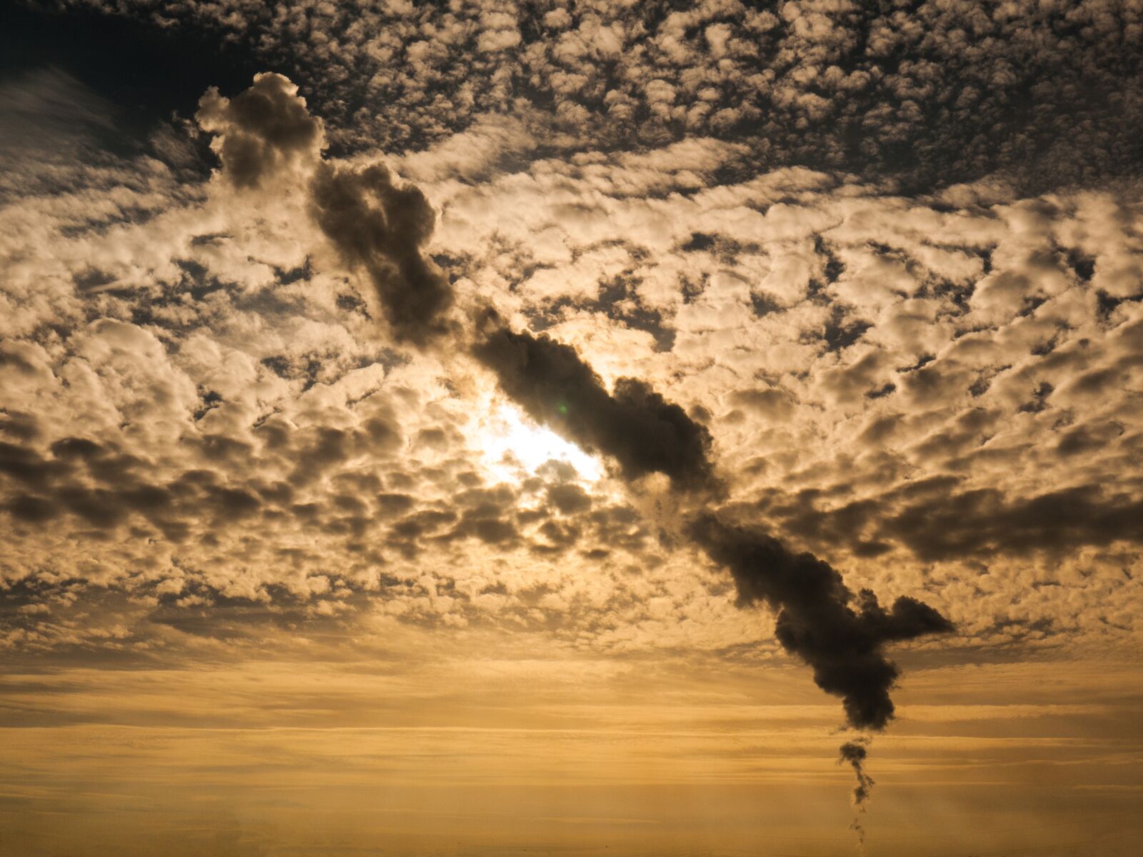 Panasonic Lumix DMC-G1 sample photo. Smoke plume, sky, clouds photography
