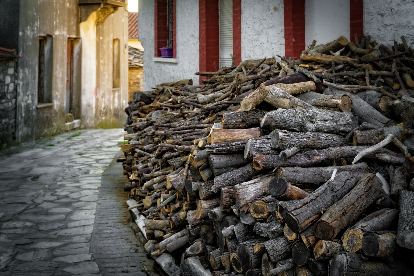 Sony a6000 + Sony E PZ 18-105mm F4 G OSS sample photo. Cement, exterior, logs, pavement photography